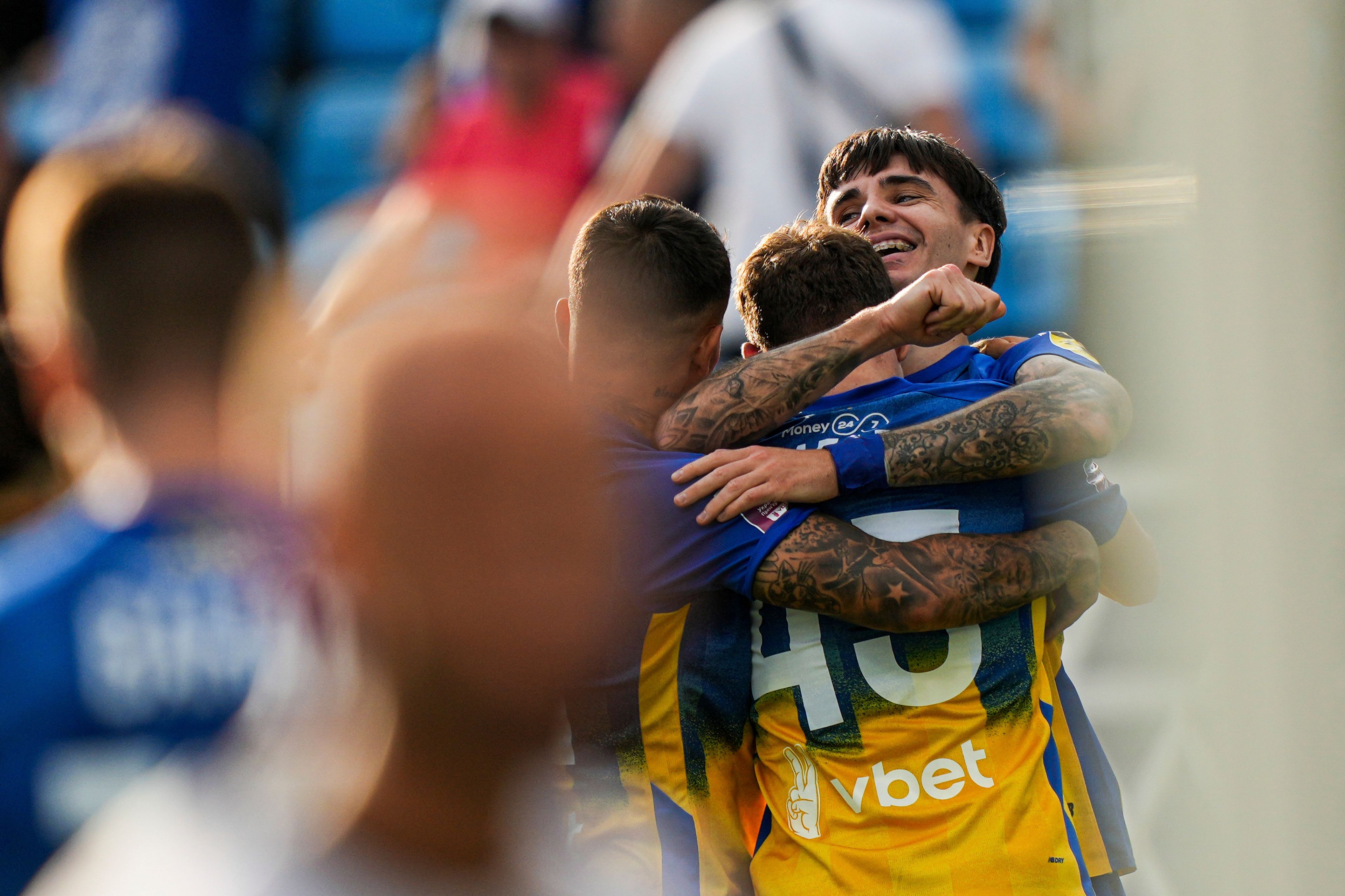 Mykola Shparenko of Dynamo Kyiv celebrates his goal with teammates during a soccer match with Zorya Luhansk in Kyiv, Ukraine, Saturday Sept. 14, 2024. (AP Photo/Evgeniy Maloletka)