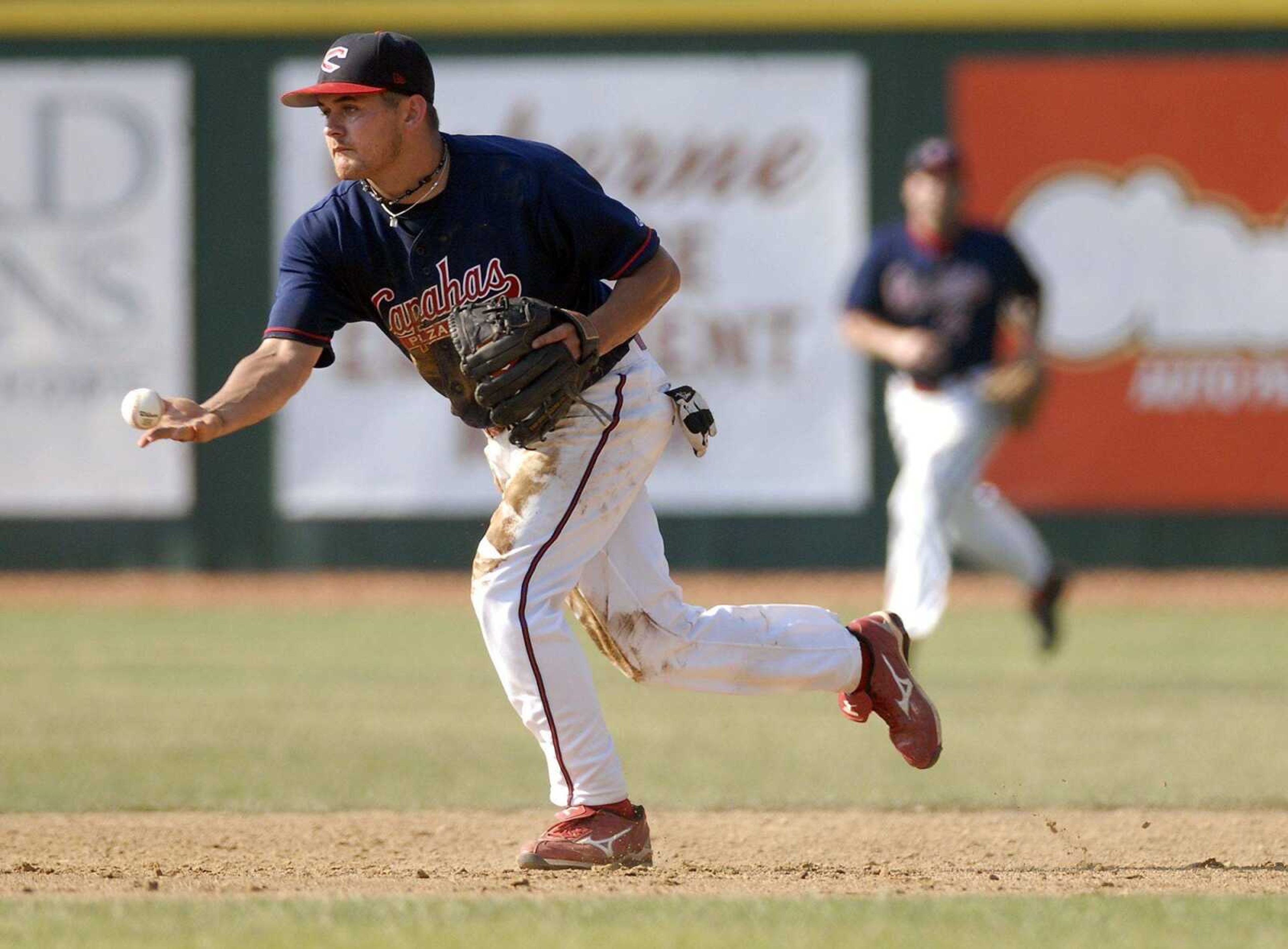 Capahas second baseman Jeremy Patton tosses to second for an out during the second inning of the first game against the Panthers on Saturday at Capaha Field. (Elizabeth Dodd)