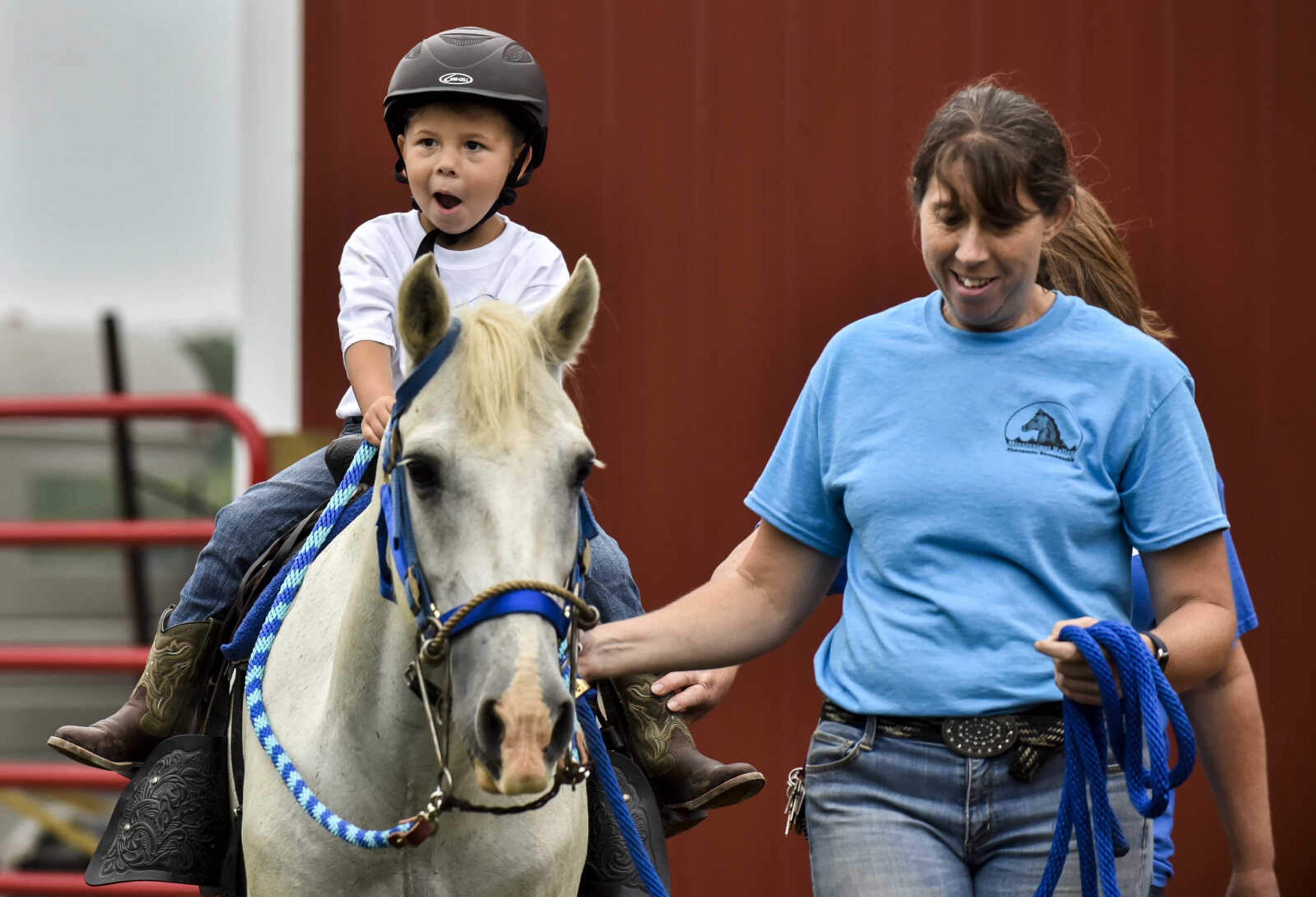 Nate Prichard, 5, rides his new horse Silver with the guidance of Varina Luttrull, program director for Mississippi Valley Therapeutic Horsemanship, Monday, July 30, 2018 in&nbsp;Burfordville.