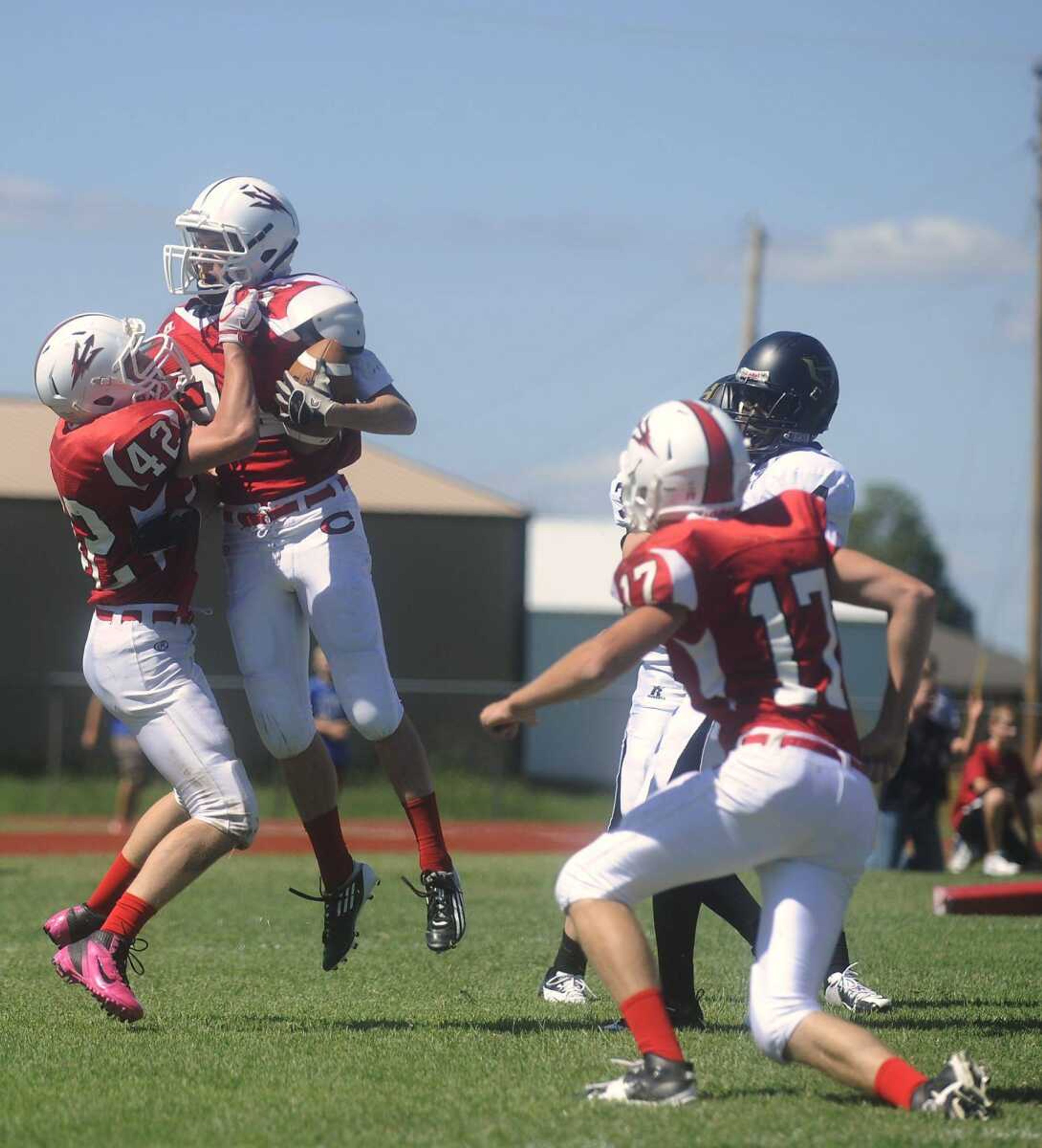 Chaffee's Thomas Robbins, left, Logan Chapman and Cody Johnson celebrate after Chapman returned a blocked Hayti Indians' punt for a touchdown in the first quarter Saturday. (ADAM VOGLER)