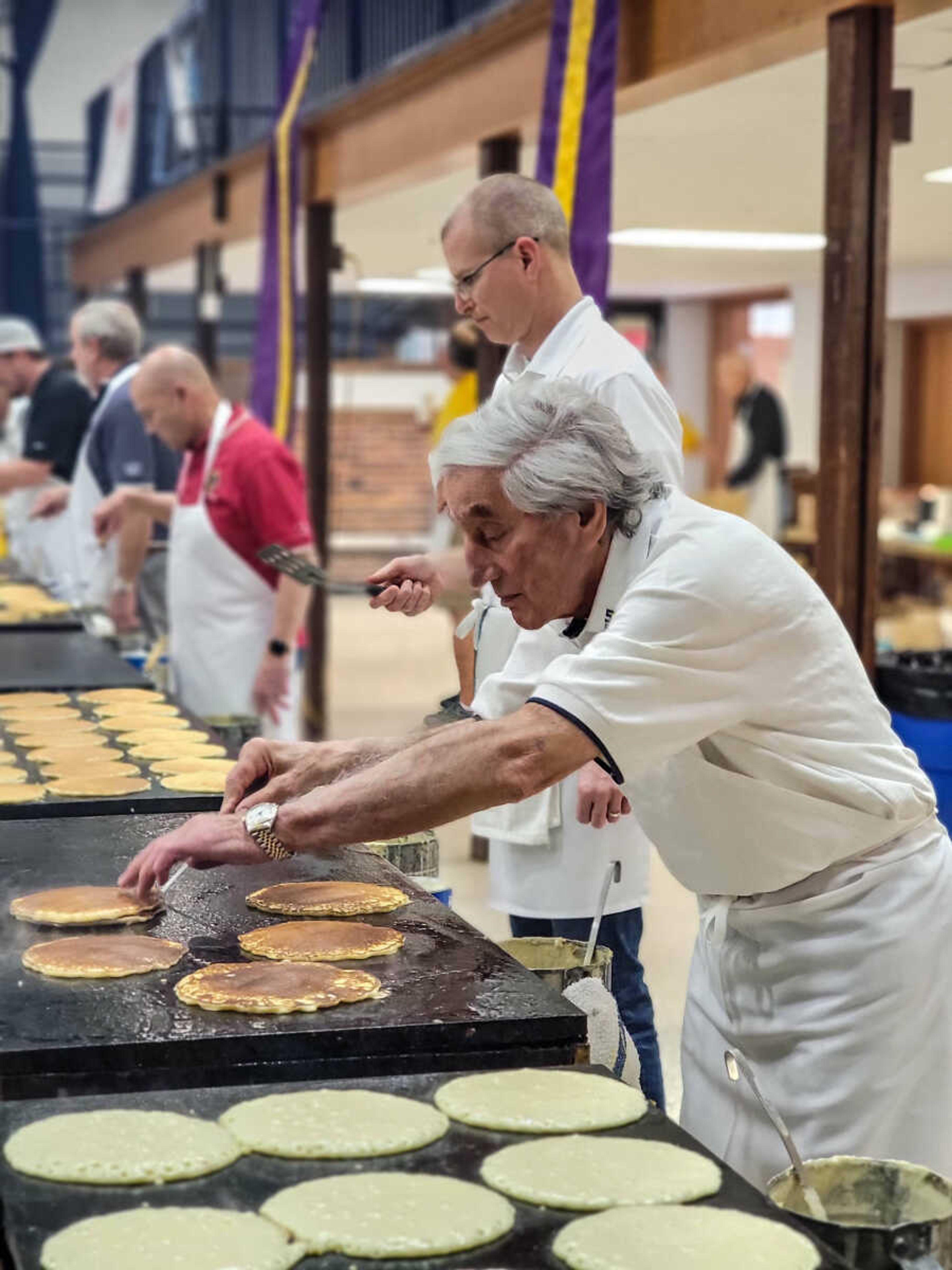 Eddie Noffel flips pancakes.