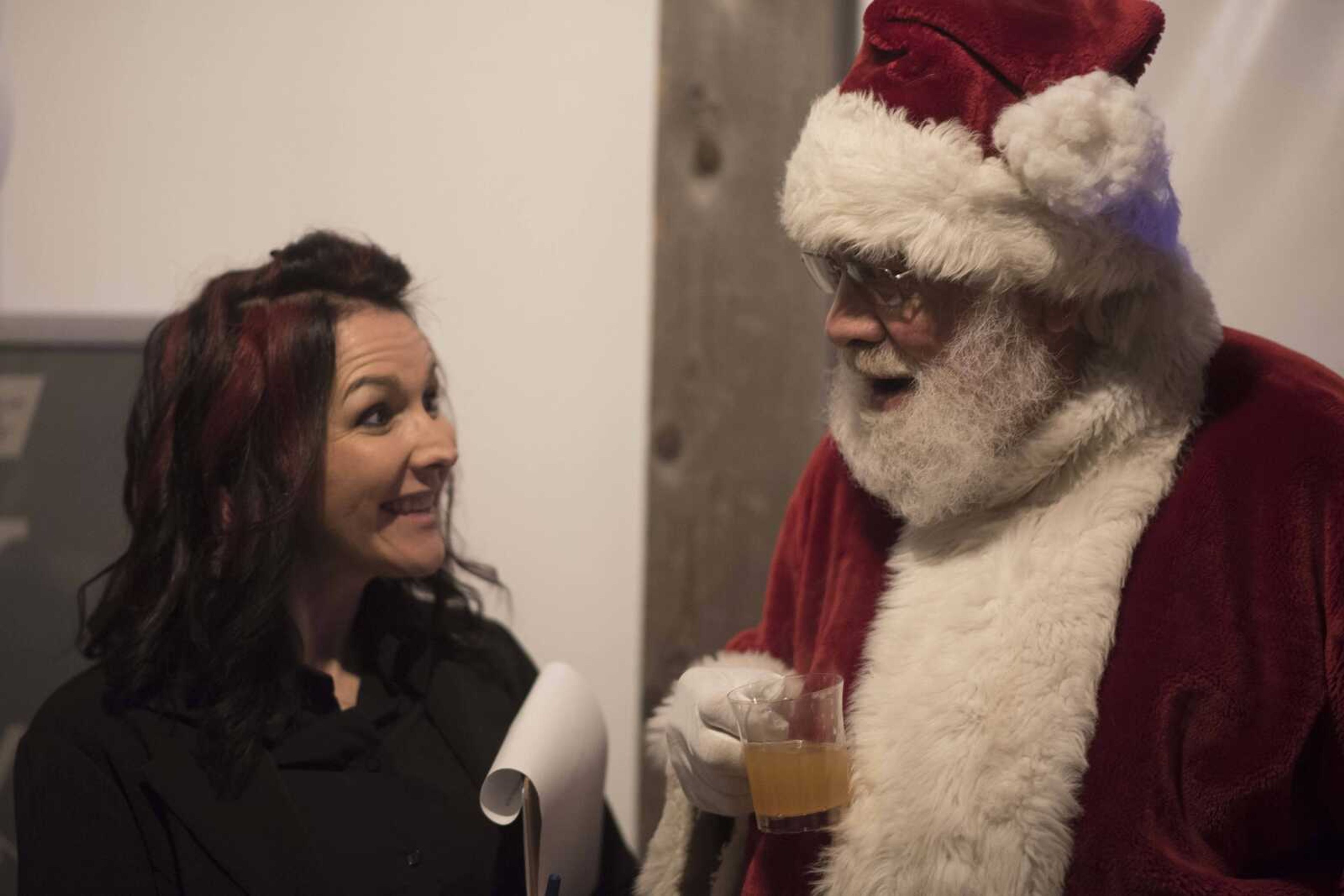 Becky McClanahand talks with Santa Claus during a fundraising gala for the American Cancer Society at Rusted Route Farms Saturday, Nov. 16, 2019, in Cape Girardeau.