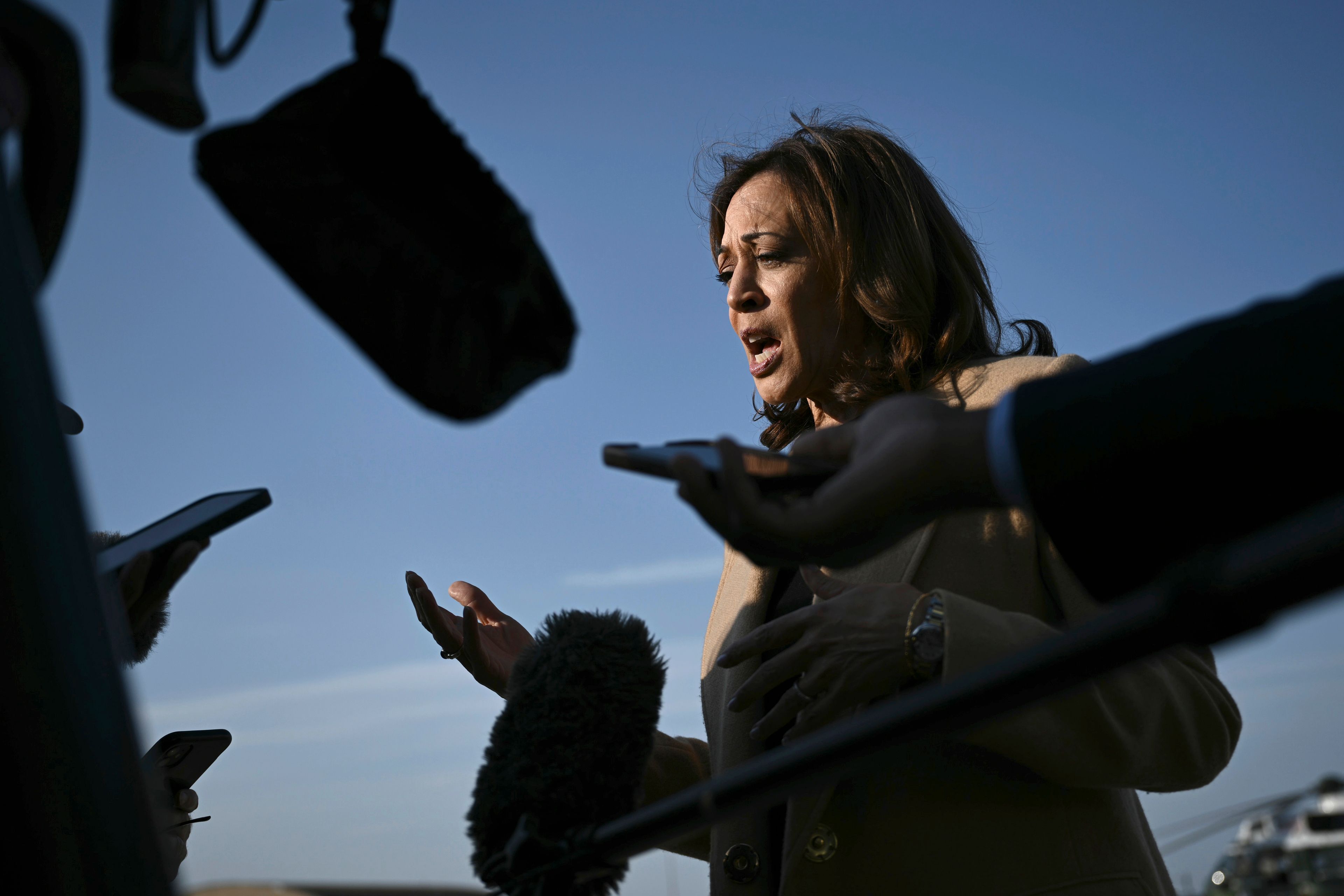 Democratic presidential nominee Vice President Kamala Harris speaks to the press before boarding Air Force Two at Joint Base Andrews, Md., Saturday, Oct. 12, 2024, en route to North Carolina for a campaign event. (Brendan Smialowski/Pool via AP)