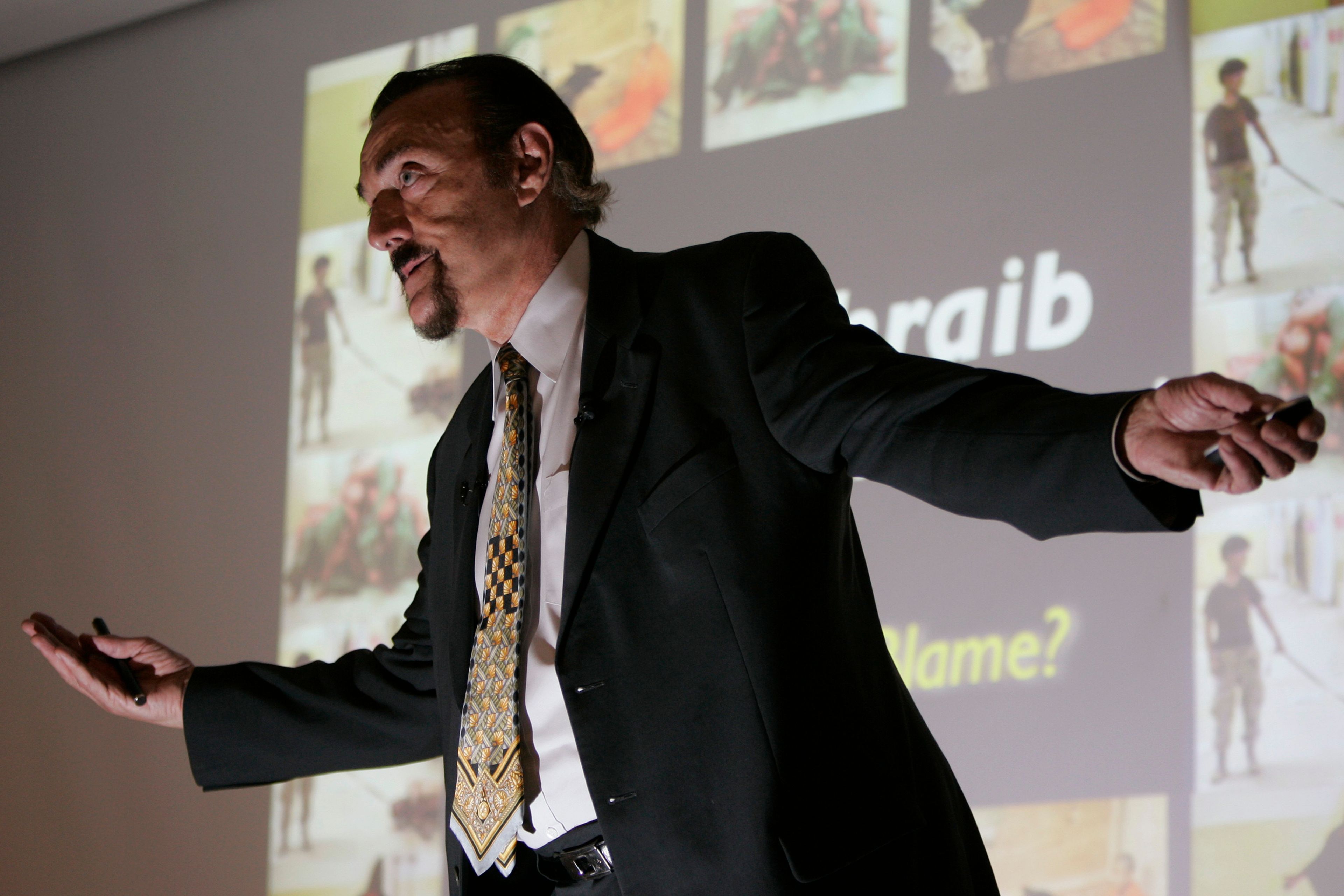 FILE - Stanford psychology professor Philip Zimbardo gives a lecture on Abu Ghraib prison on the Stanford University campus in Palo Alto, Calif., Wednesday, March 7, 2007. (AP Photo/Paul Sakuma, File)