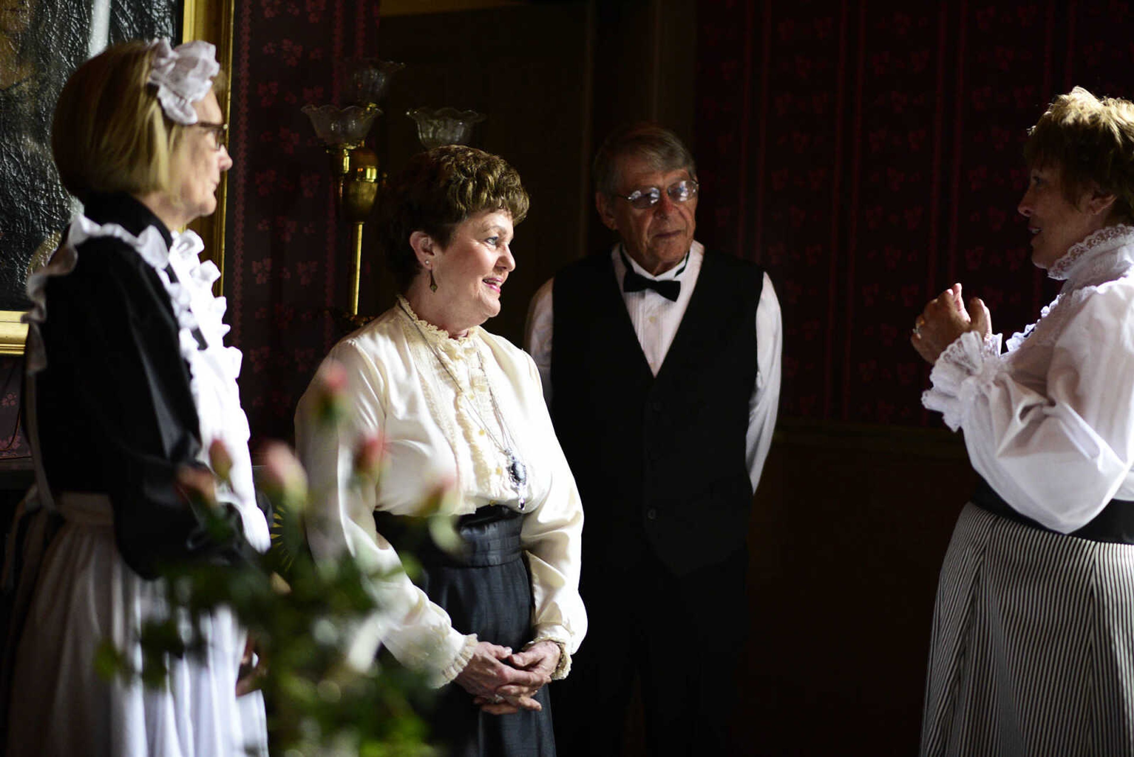 From left to right, Linda Ingram, Mary Lou Bass, Tom Bass and Jane Stephens, all dressed in period costume, visit inside the Glenn House dining room on Wednesday, Aug. 16, 2017, in Cape Girardeau. KMOS-TV, a PBS affiliate, was filming inside the historic home for its Missouri Life show.