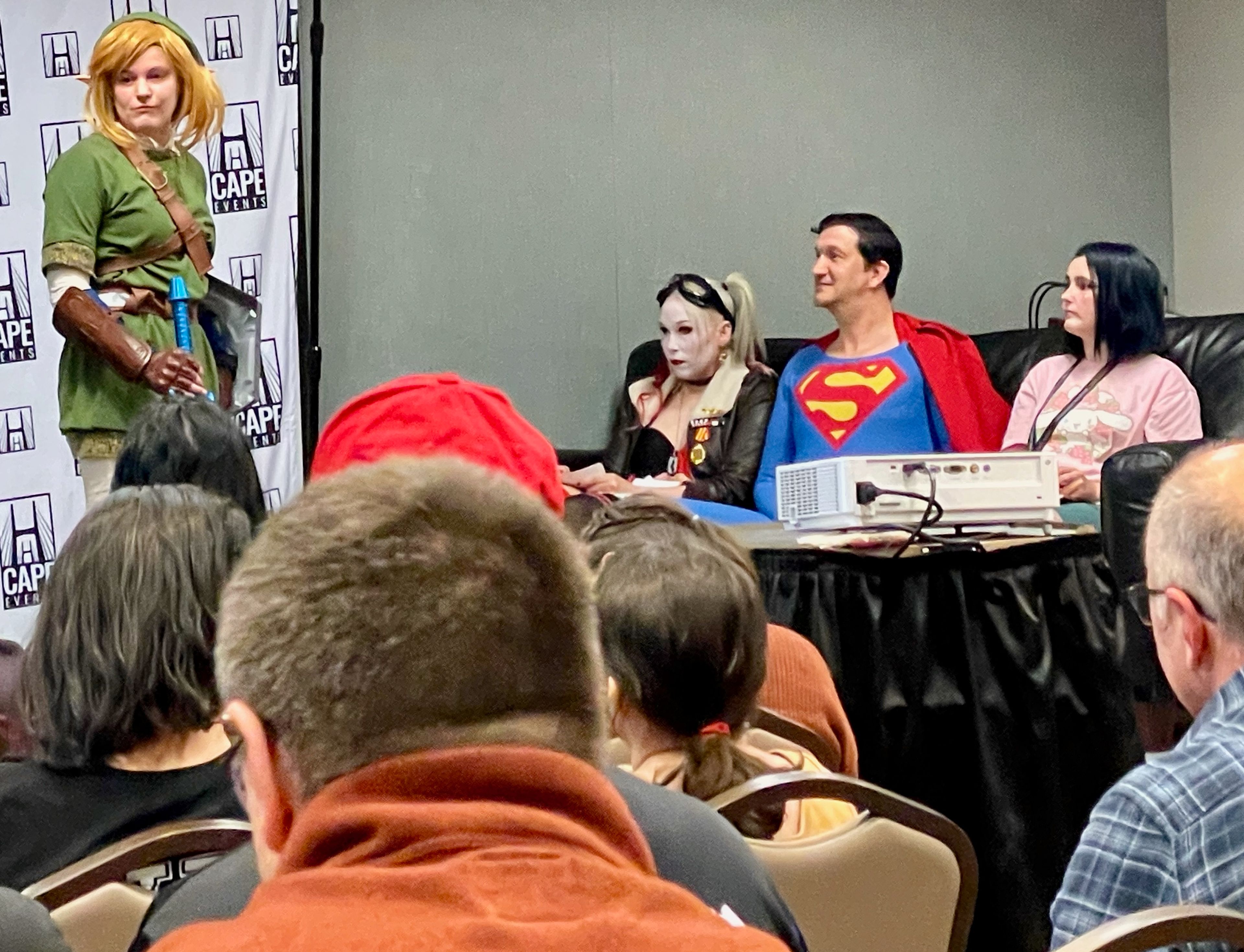 Judges in the cosplay contest ask questions to one of the contestants.