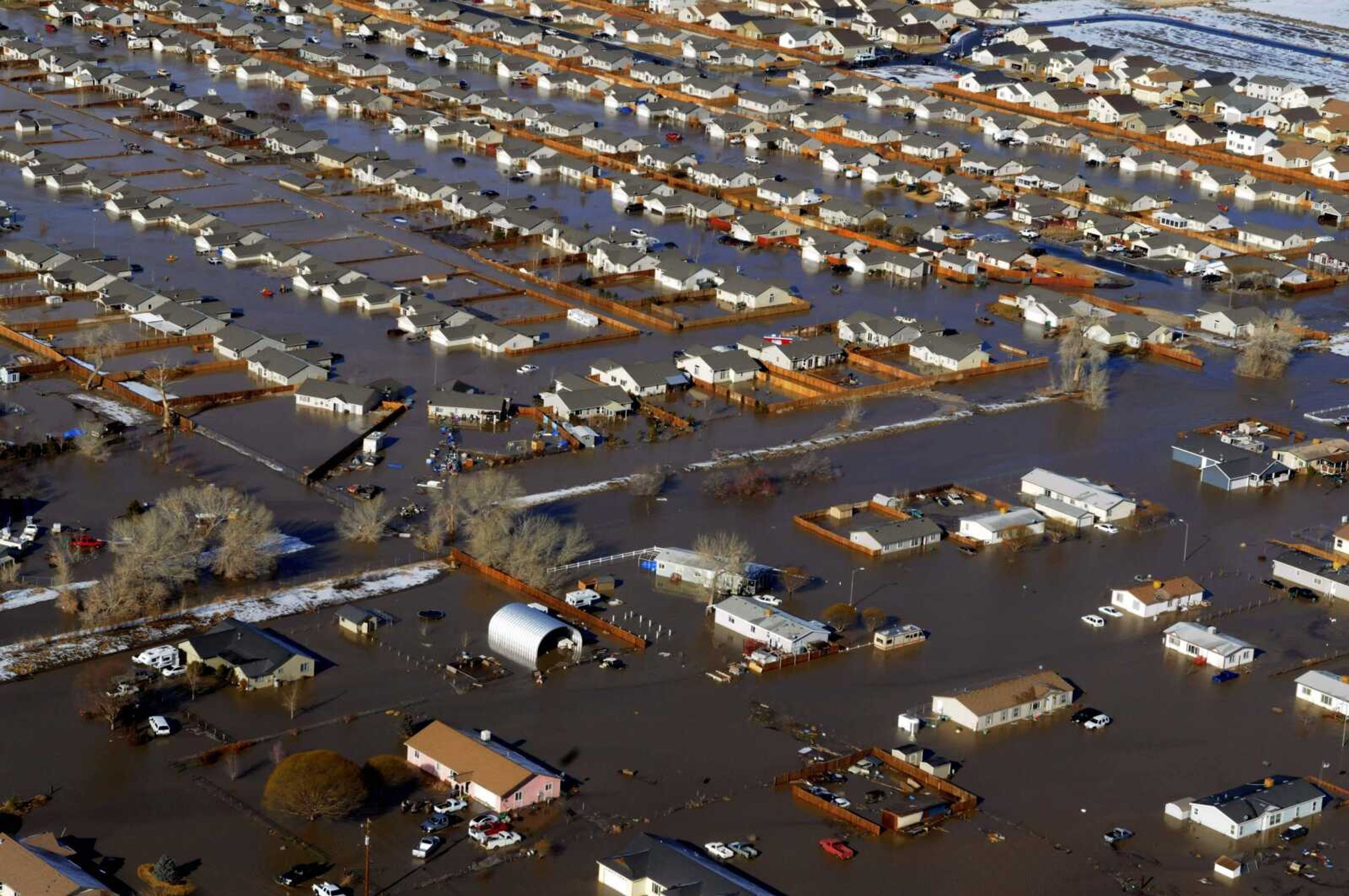 The Truckee Carson Irrigation Ditch gave way Saturday causing much of Fernley, Nev., to be flooded. The levee ruptured after heavy rainfall. Crews are already working to fill in the bank that gave way. (MARILYN NEWTON ~ The Gazette-Journal)