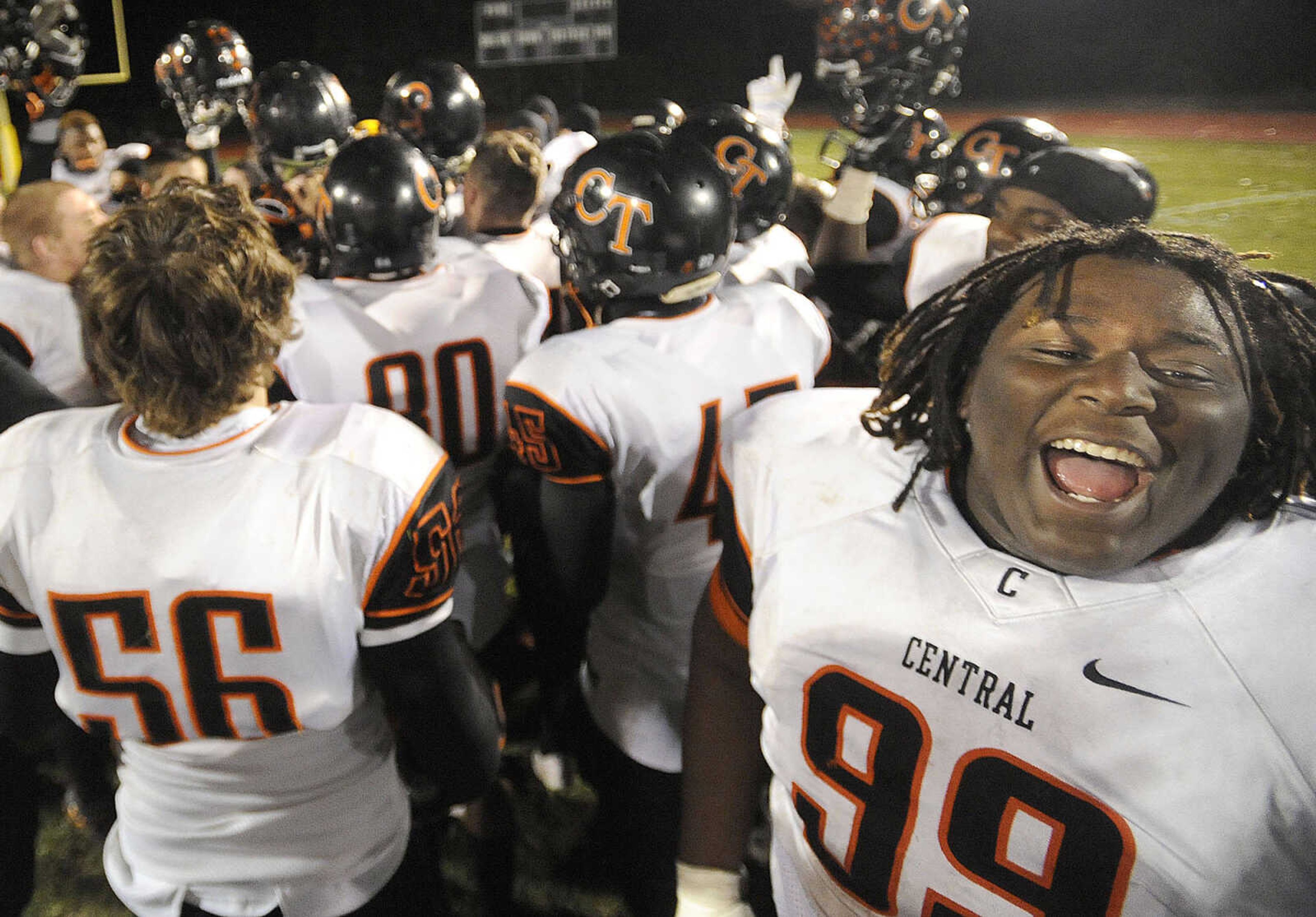 Central defensive lineman Lamarcus Johnson, right, celebrates with teammates after their 34-14 victory over Affton in the Class 4 state quarterfinal Friday, Nov. 14, 2014 in Affton, Missouri. (Fred Lynch)