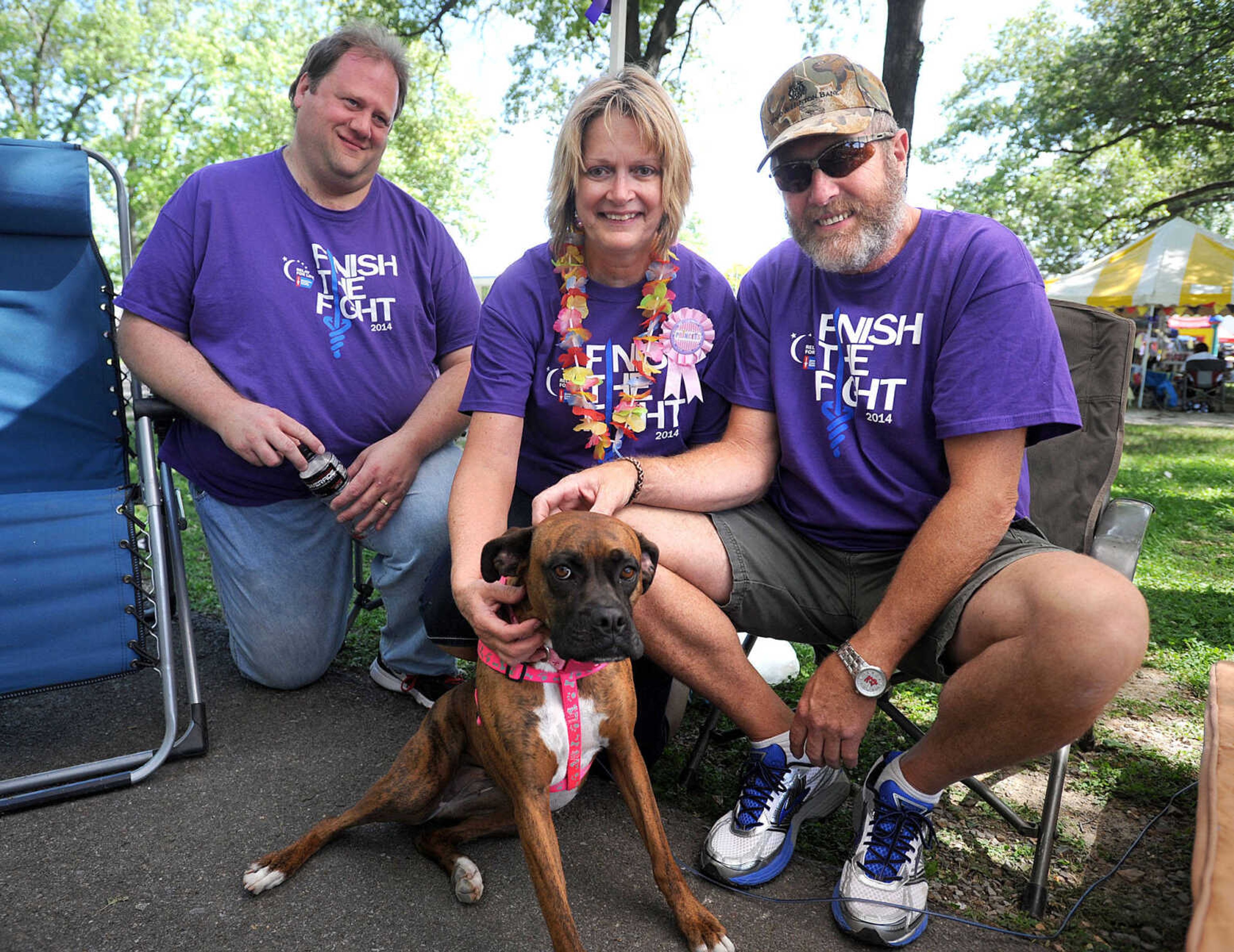 LAURA SIMON ~ lsimon@semissourian.com

Chuck Grant, left, Priscilla and Reid Mabuce and Harley the Boxer pose for a photo, Saturday, June 14, 2014, during the Relay for Life of Cape Girardeau County fundraiser at Arena Park.