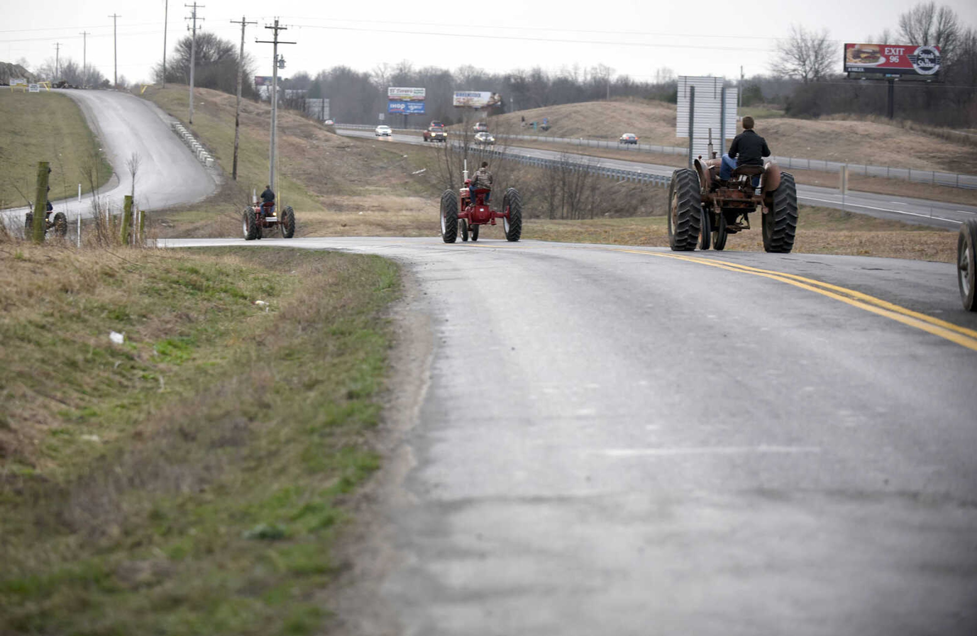 Saxony Lutheran High School FFA students take to the road on their tractors during drive your tractor to school day on Tuesday morning, Feb. 21, 2017. Students began their journey to school from Davis Farm Supply on Highway 61 in Jackson as part of FFA Week.