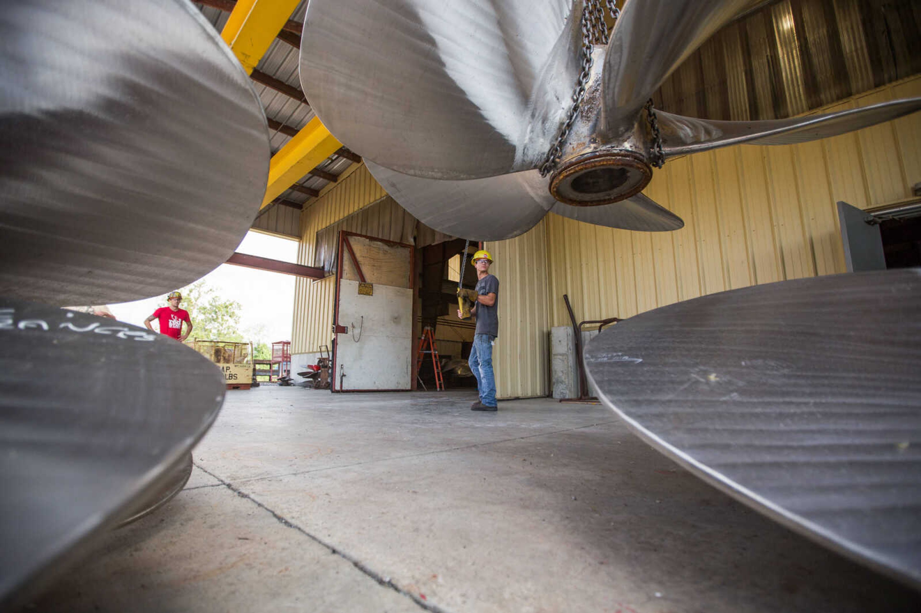 GLENN LANDBERG ~ glandberg@semissourian.com

Kyler Hale moves a propeller outside the repair shop at Missouri Dry Dock and Repair Co. in Cape Girardeau Wednesday, July 28, 2016.