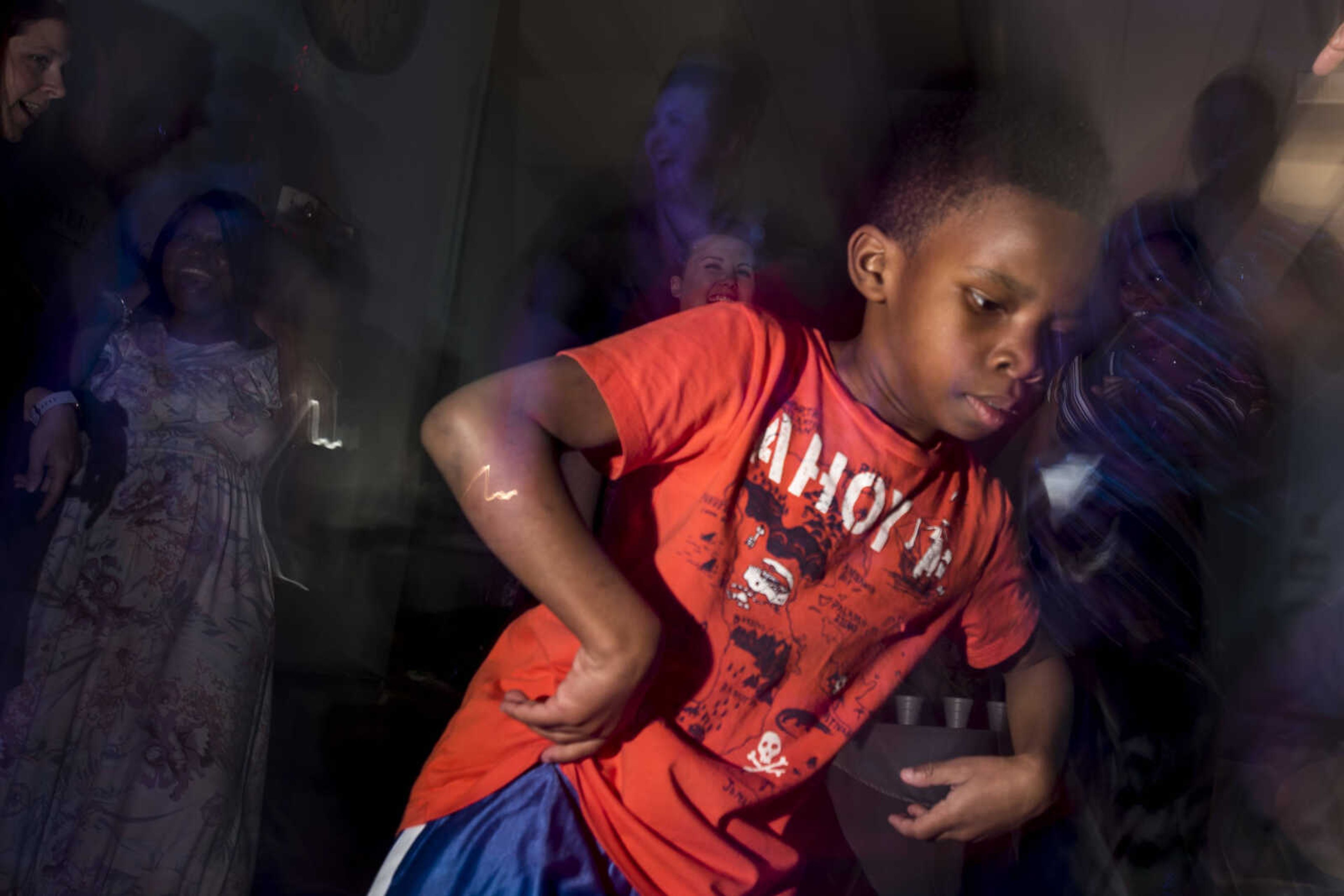 Khyree Starr, 7, takes to the dance floor during the Blue Light Ball Friday, April 12, 2019, at SEMO Alliance for Disability Independence, Inc. in Cape Girardeau.