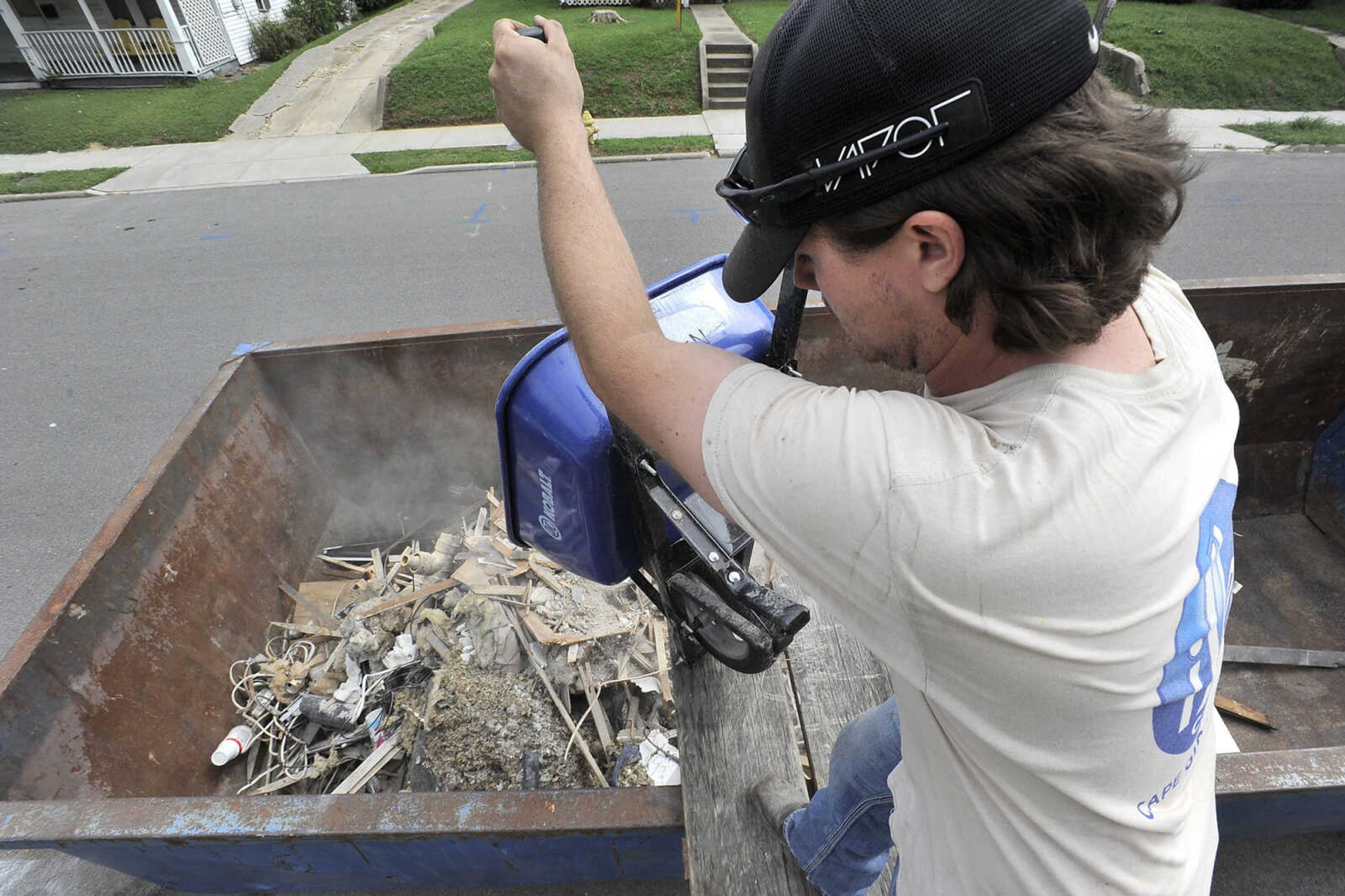 FRED LYNCH ~ flynch@semissourian.com
Schyler Trankler dumps debris outside the veterans transition house Saturday, Sept. 10, 2016 as part of the United Way Days of Caring in Cape Girardeau.