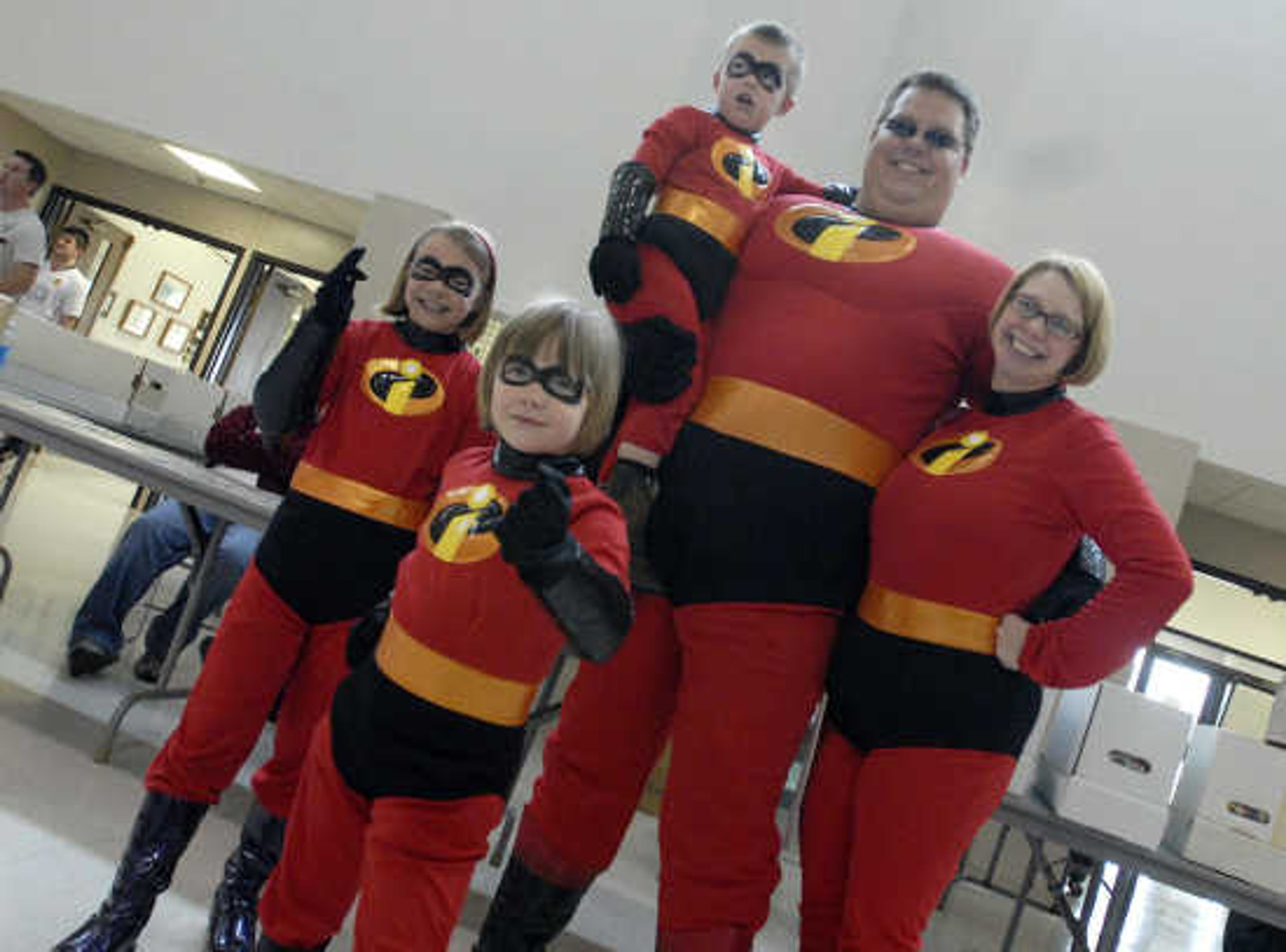 The Incredibles pose for a photo Saturday, May 1, 2010, during the fifth annual Cape Comic Con at the Osage Center.