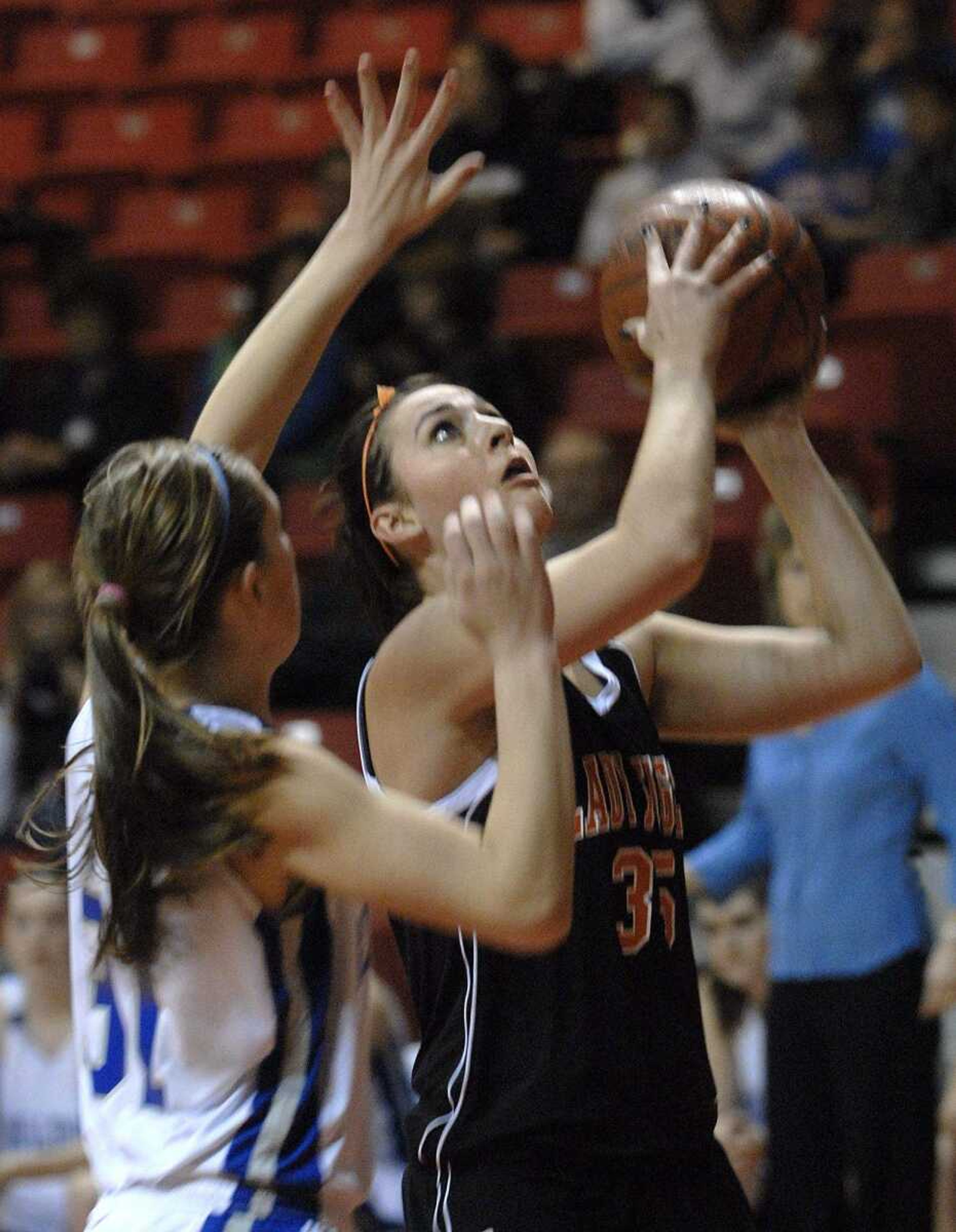 FRED LYNCH ~ flynch@semissourian.com
Central's Wendi Zickfield shoots as Notre Dame's Meghan Dohogne defends in the first quarter Monday at the Show Me Center.