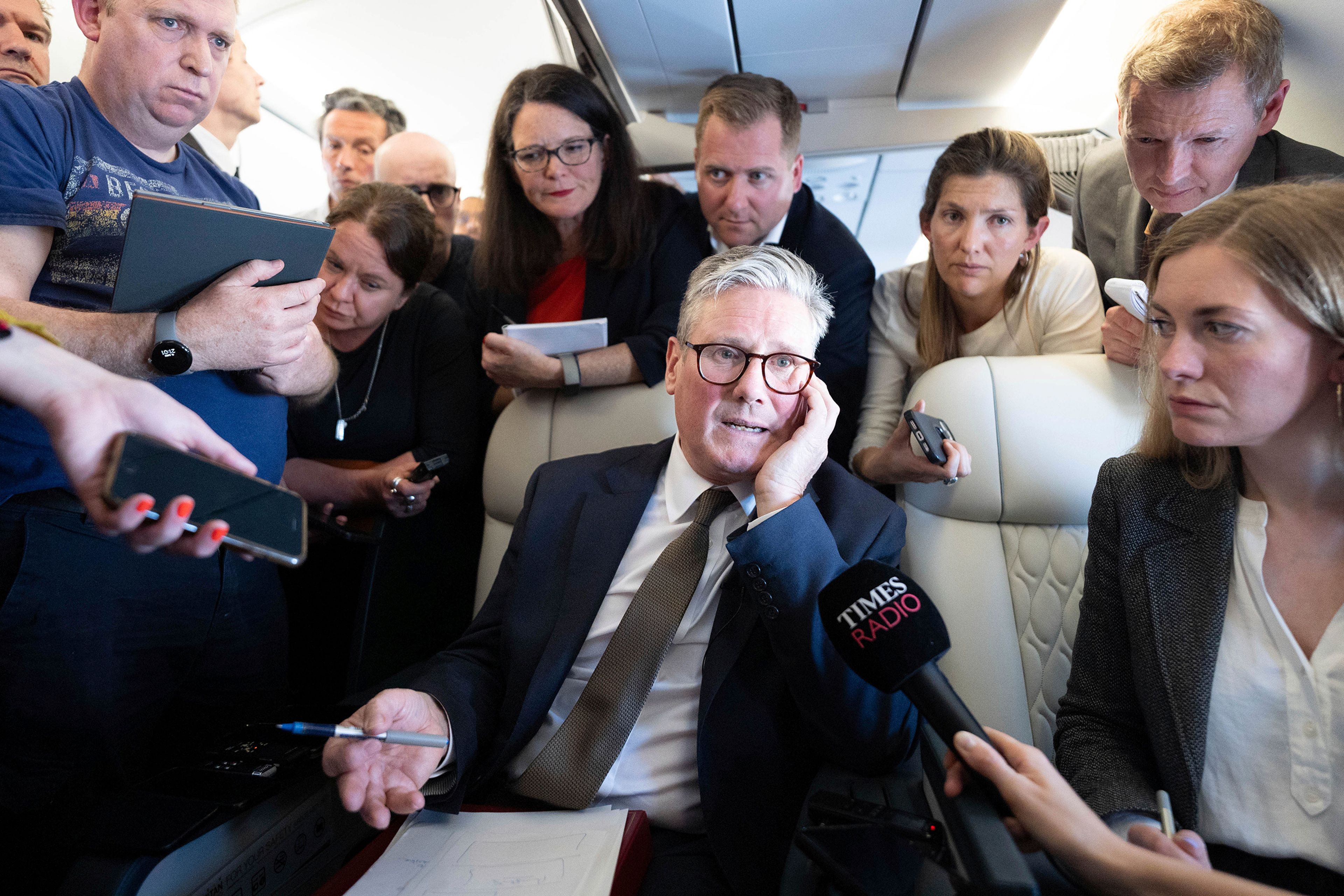 FILE - Britain's Prime Minister Keir Starmer talks to journalists as he travels onboard a plane to Washington DC to attend a Nato summit, Tuesday July 9, 2024. (Stefan Rousseau/Pool Photo via AP, File)