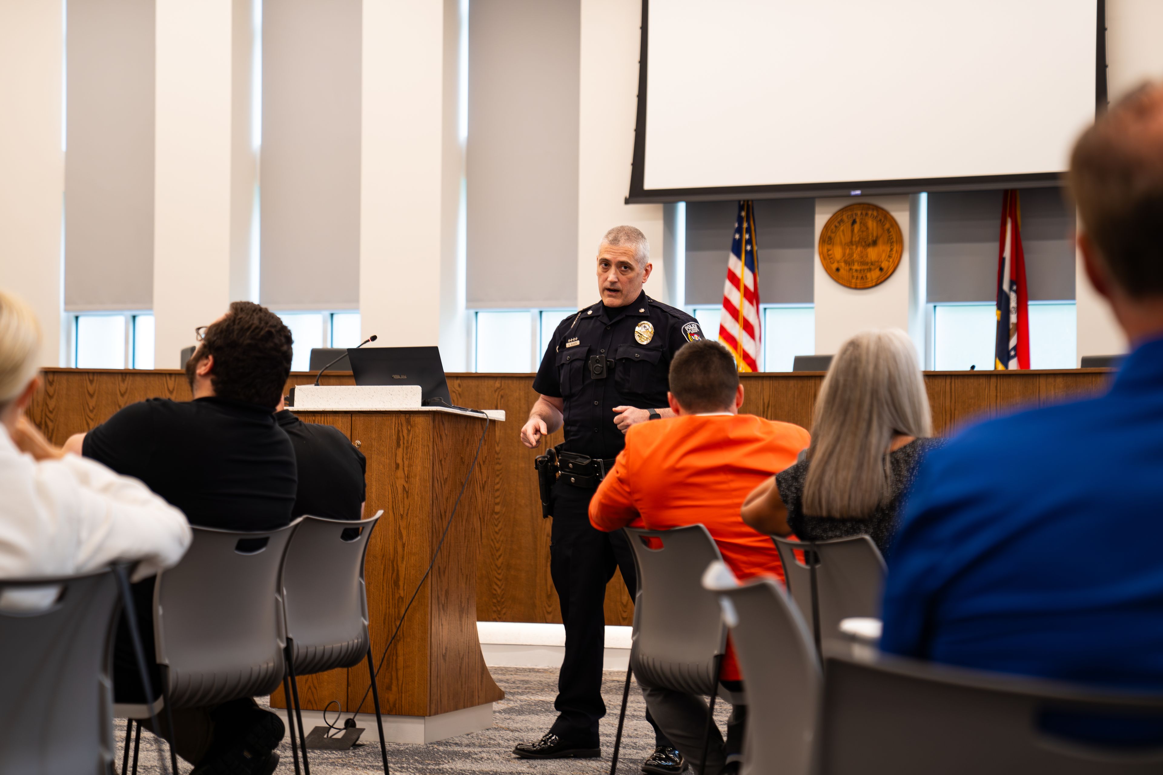 Interim police chief Adam Glueck addresses the Gun Violence Task Force's questions during their first meeting on Tuesday, July 23 at City Hall.