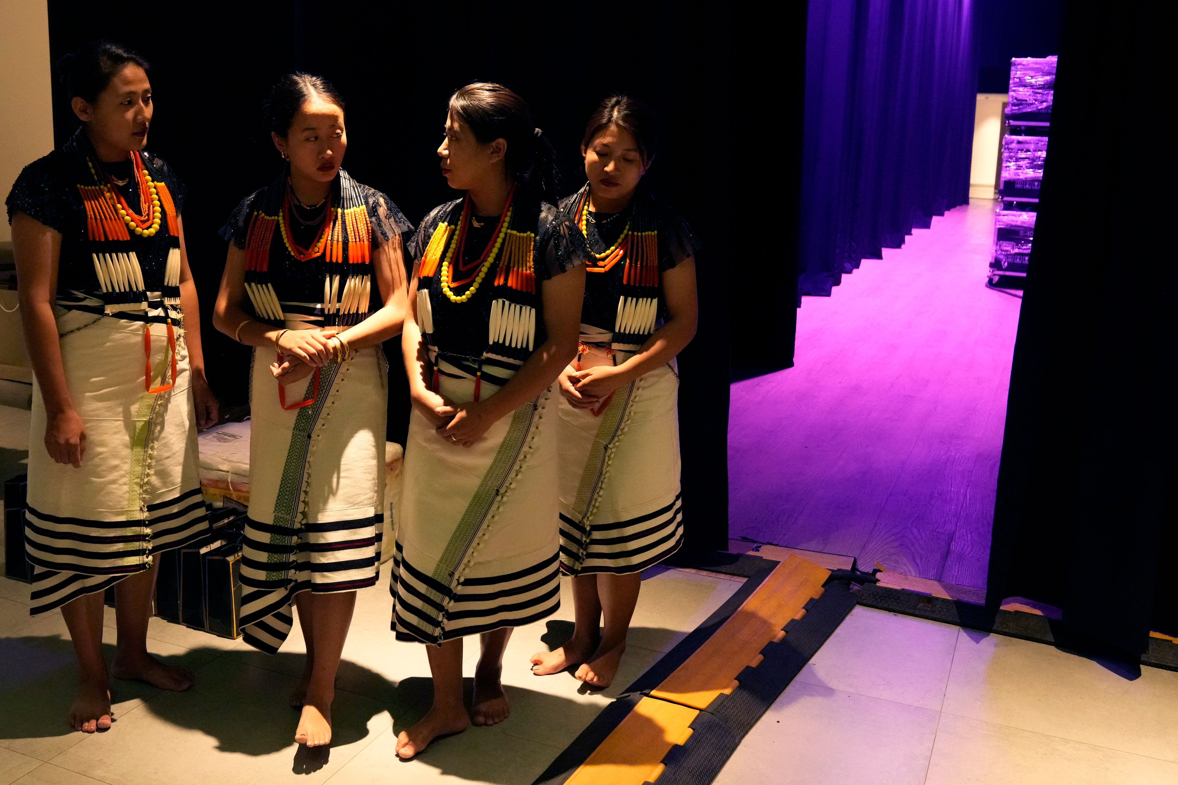 Artists from India's northeastern state of Nagaland wait backstage for their performance at the two-day Brillante Piano Festival in Bengaluru, India, Sunday, Sept. 29, 2024. (AP Photo/Aijaz Rahi)