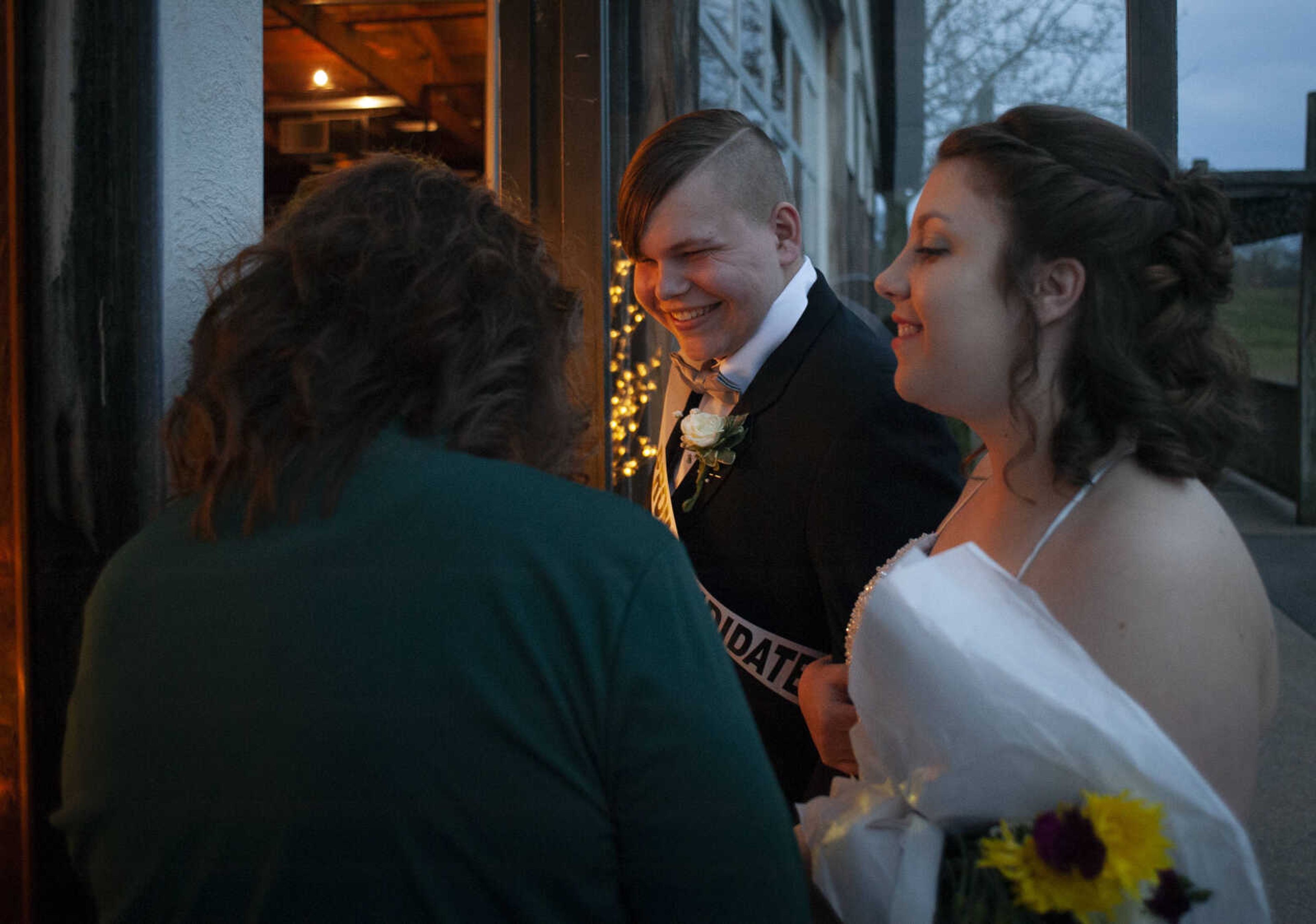 Scott City seniors and prom candidates David Posey and Emma Wilhelm prepare to be announced while talking with Scott City English teacher Leanne Grant, left, during Scott City's prom Saturday, April 6, 2019, at Deerfield Lodge in Cape Girardeau.