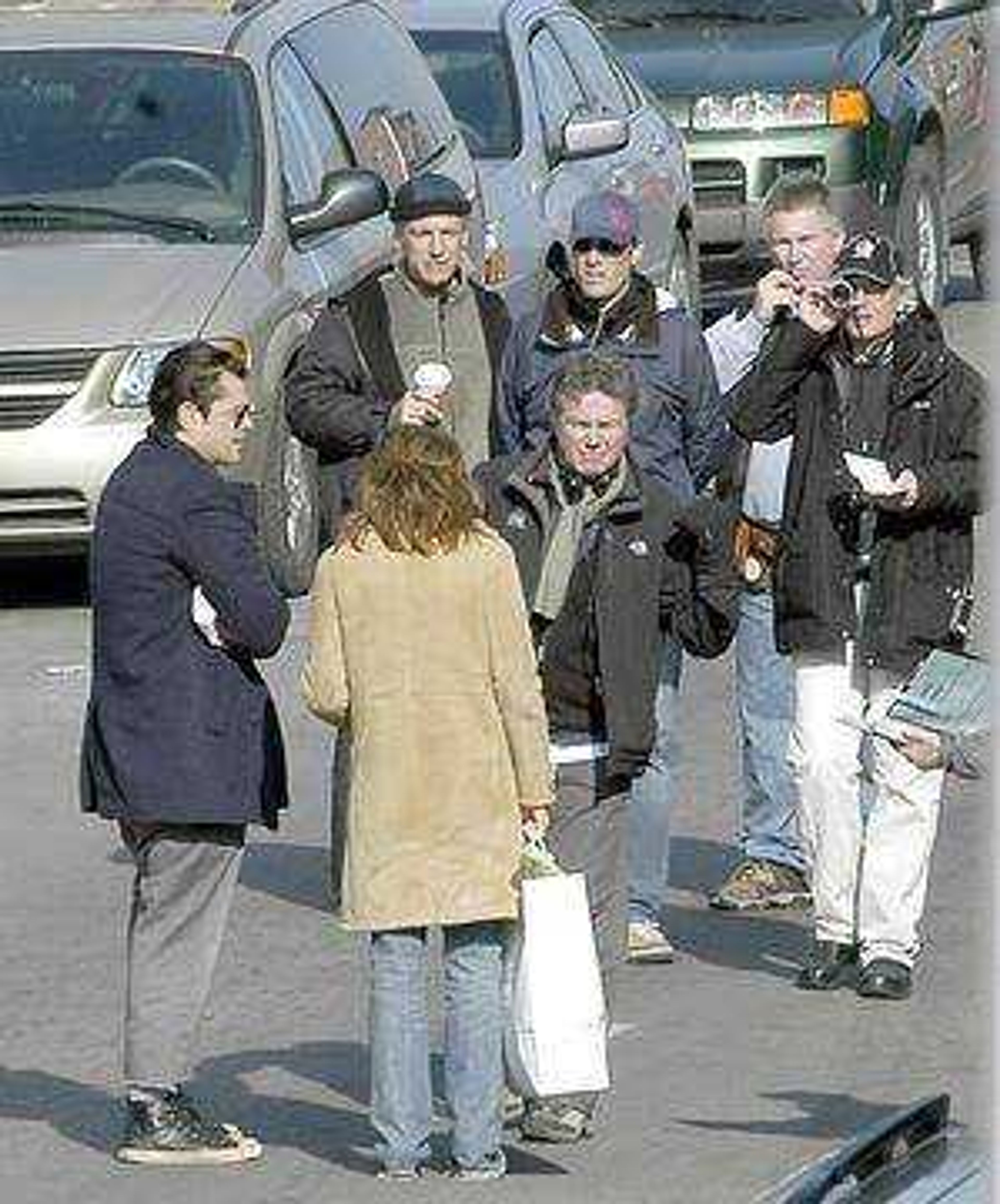 Diane Lane and Johnny Knoxville talked to director John Madden along Main
Street before filming one of the scenes.  (Diane L. Wilson)