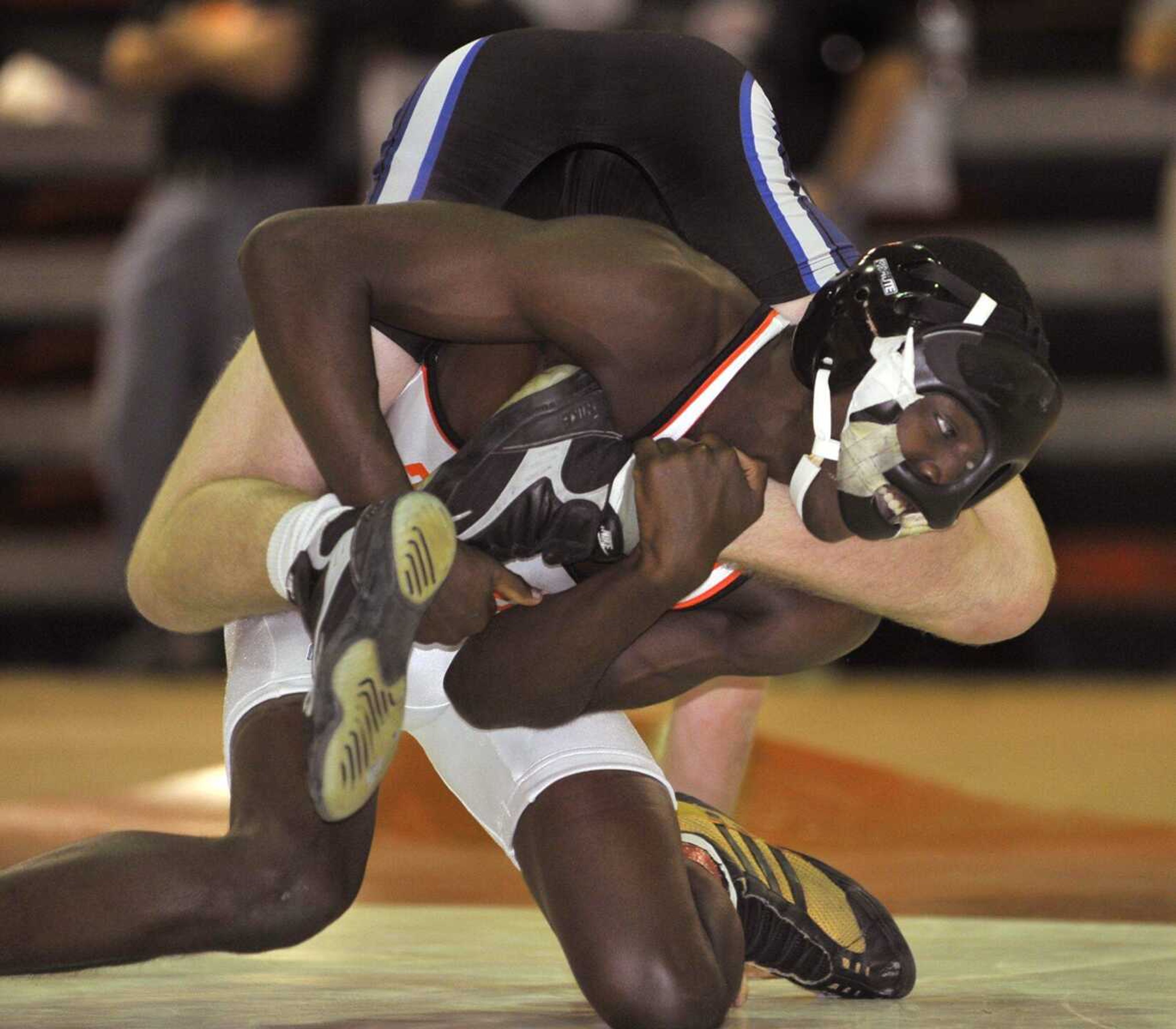 Central's Desmond Howard wrestles Andrew Angelback of Northwest in the 130-pound final Saturday at the Tiger Classic. Howard won the match. (Fred Lynch)