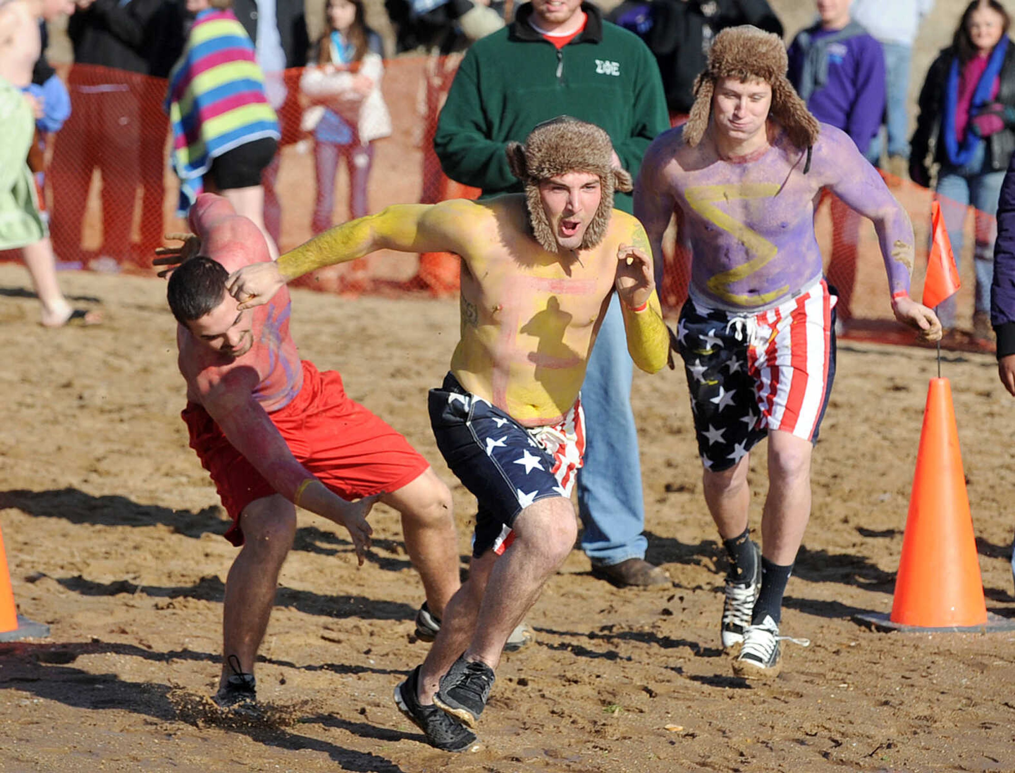 LAURA SIMON ~ lsimon@semissourian.com
People plunge into the cold waters of Lake Boutin Saturday afternoon, Feb. 2, 2013 during the Polar Plunge at Trail of Tears State Park. Thirty-six teams totaling 291 people took the annual plunge that benefits Special Olympics Missouri.