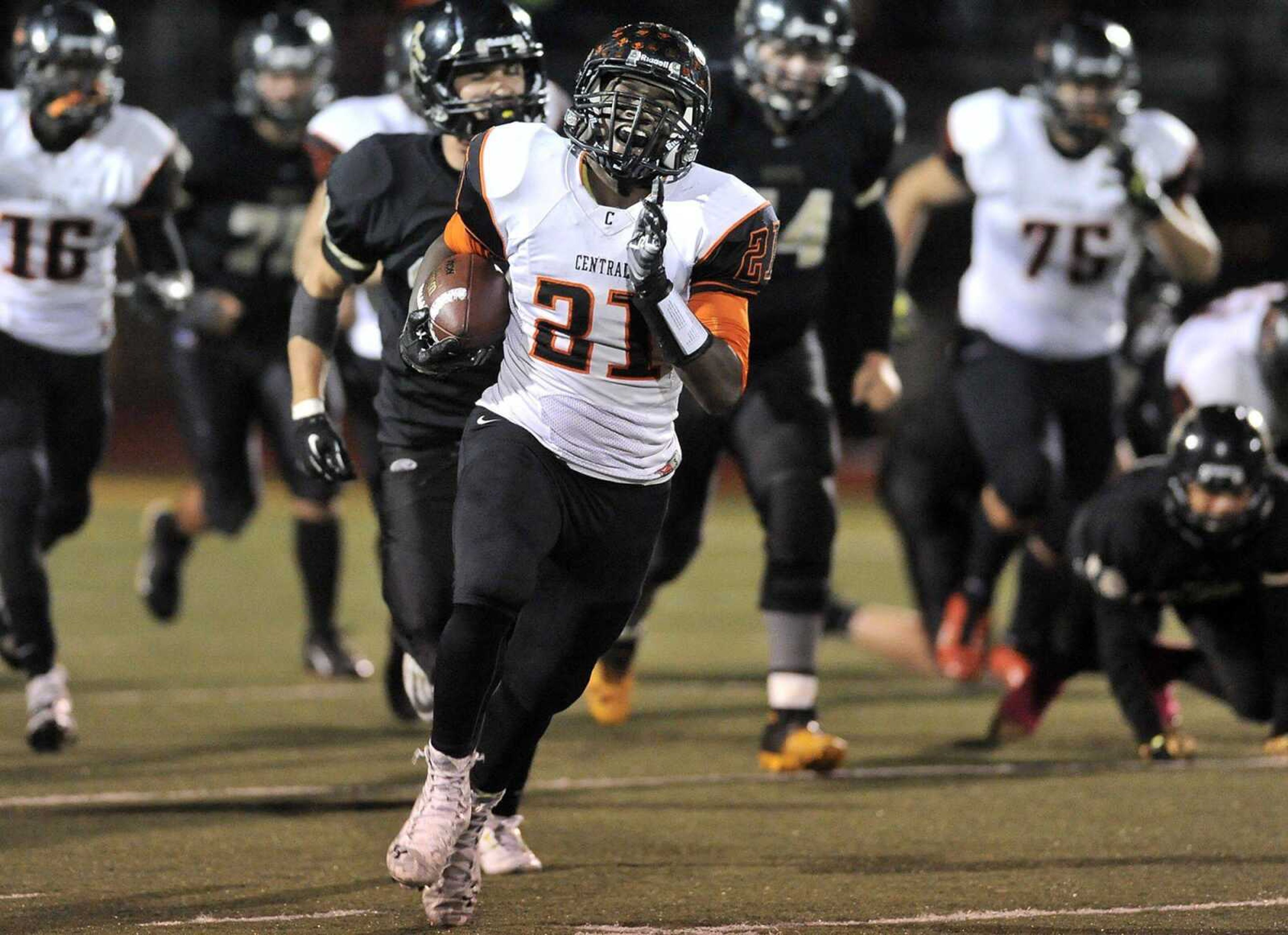 Central's Braion Owens carries 44 yards to set up a touchdown pass against Farmington during the third quarter Friday, Oct. 3, 2014 in Farmington, Missouri. (Fred Lynch)