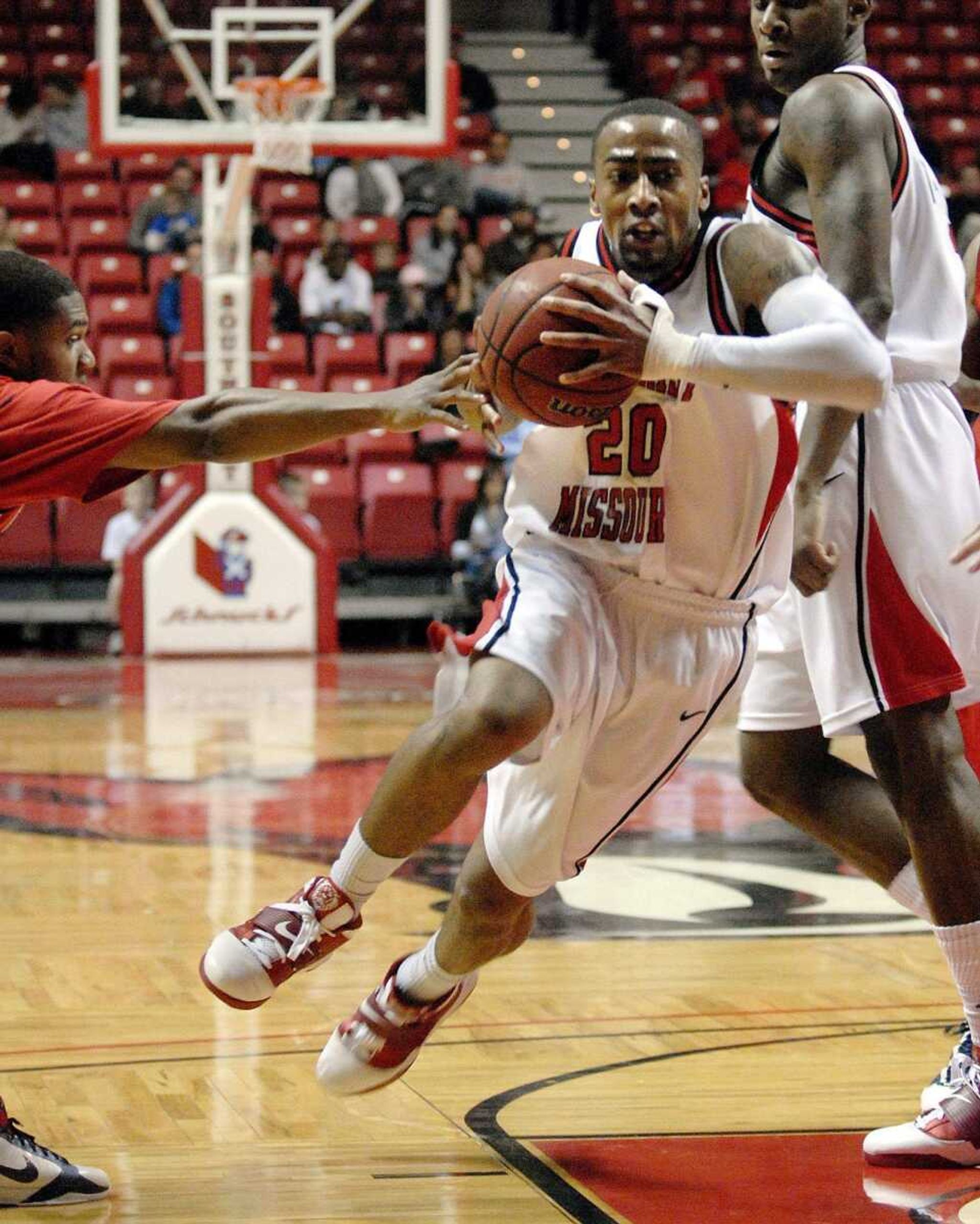 Southeast senior Anthony Allison drives to the basket against Hannibal-LaGrange during Saturday's game at the Show Me Center. The Redhawks earned their first win of the season, a 101-52 victory. (Laura Simon)