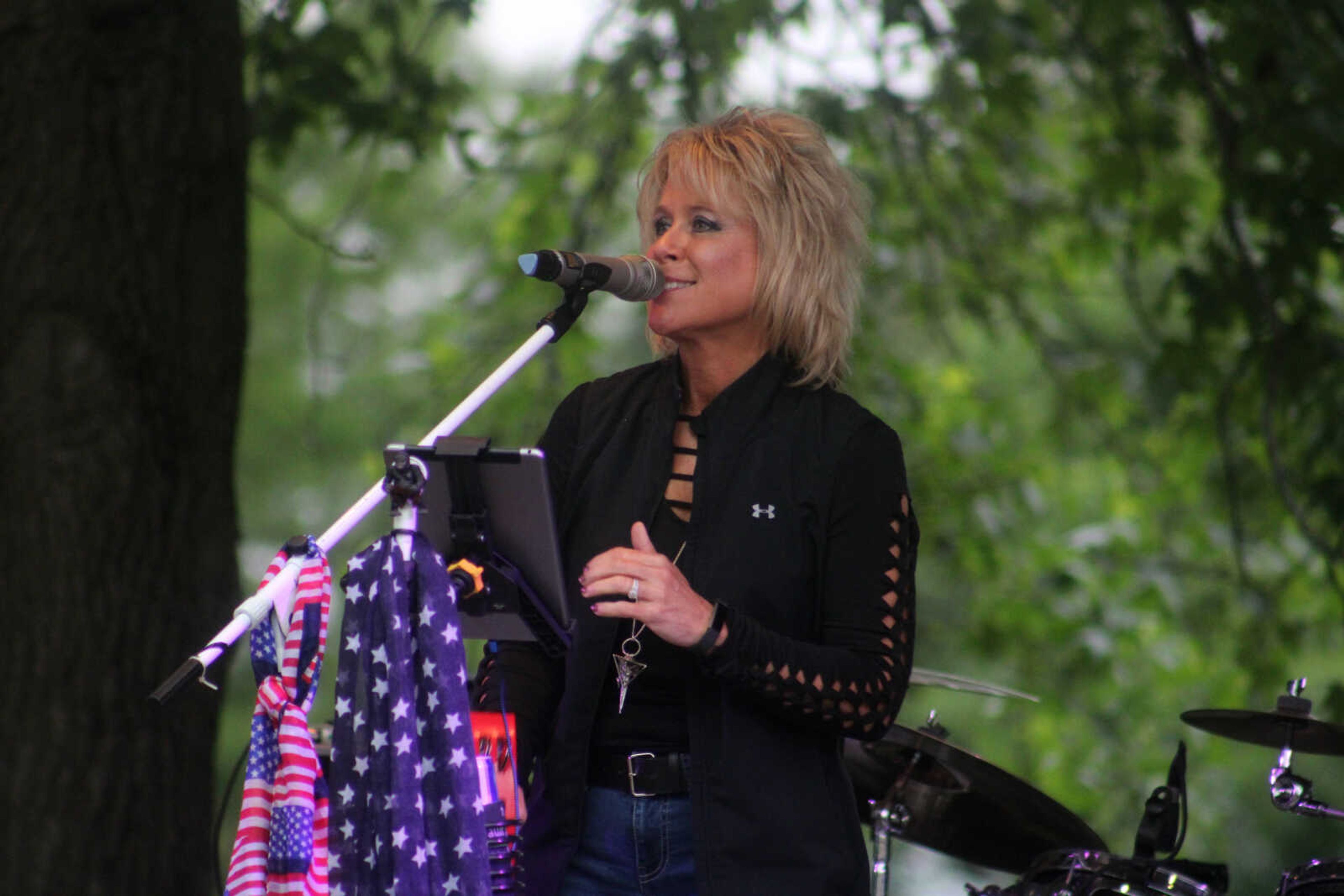 The lead singer of Fault Line Band performs during Scott City Summerfest on Friday, May 28, at Scott City Park in Scott City.