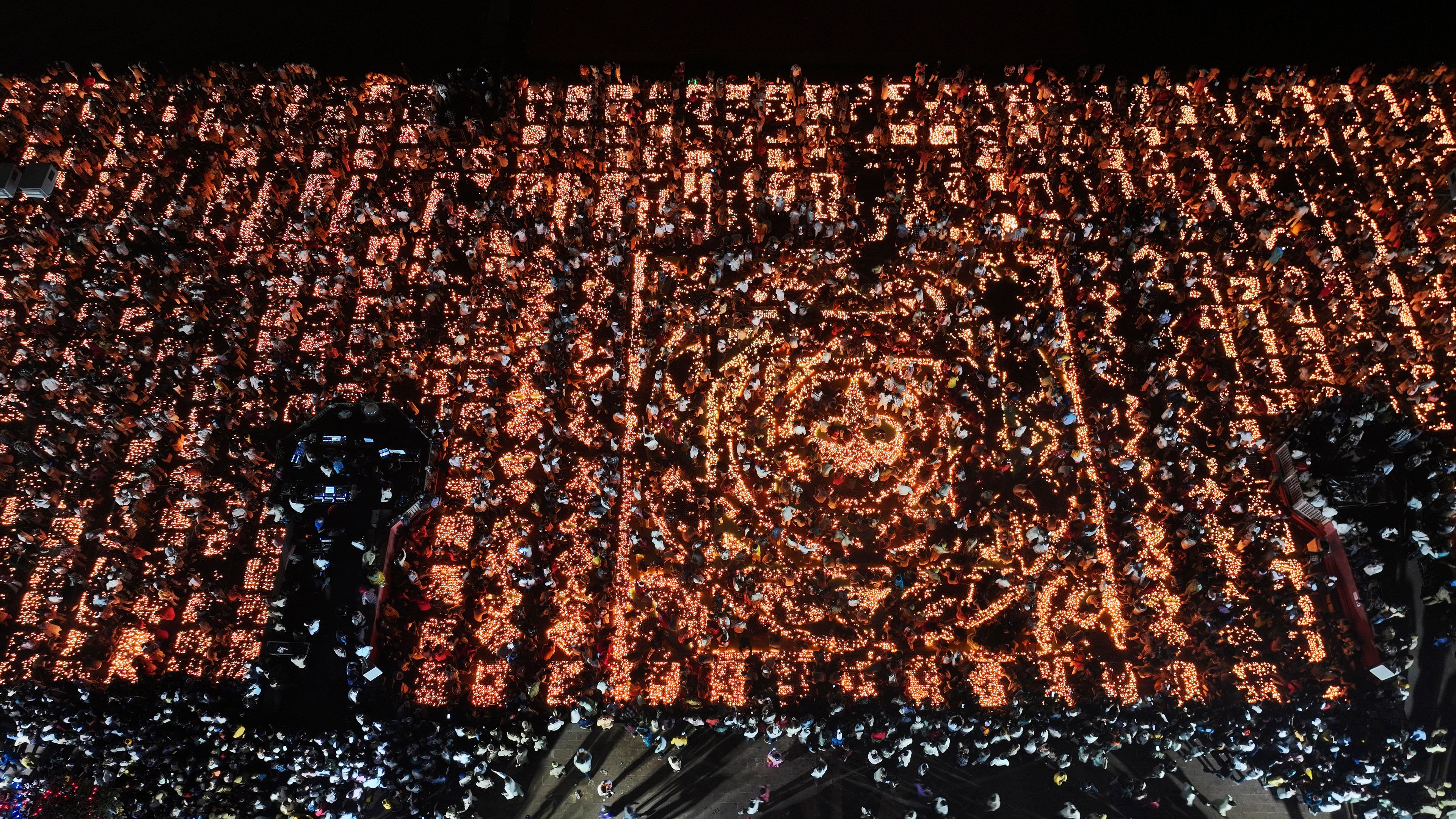 A record 2.51 million earthen oil lamps are lit along the Saryu river during Deepotsav celebrations on the eve of Diwali, creating a new Guinness World Record, in Ayodhya, India, Wednesday, Oct. 30, 2024. (AP Photo/Rajesh Kumar Singh)