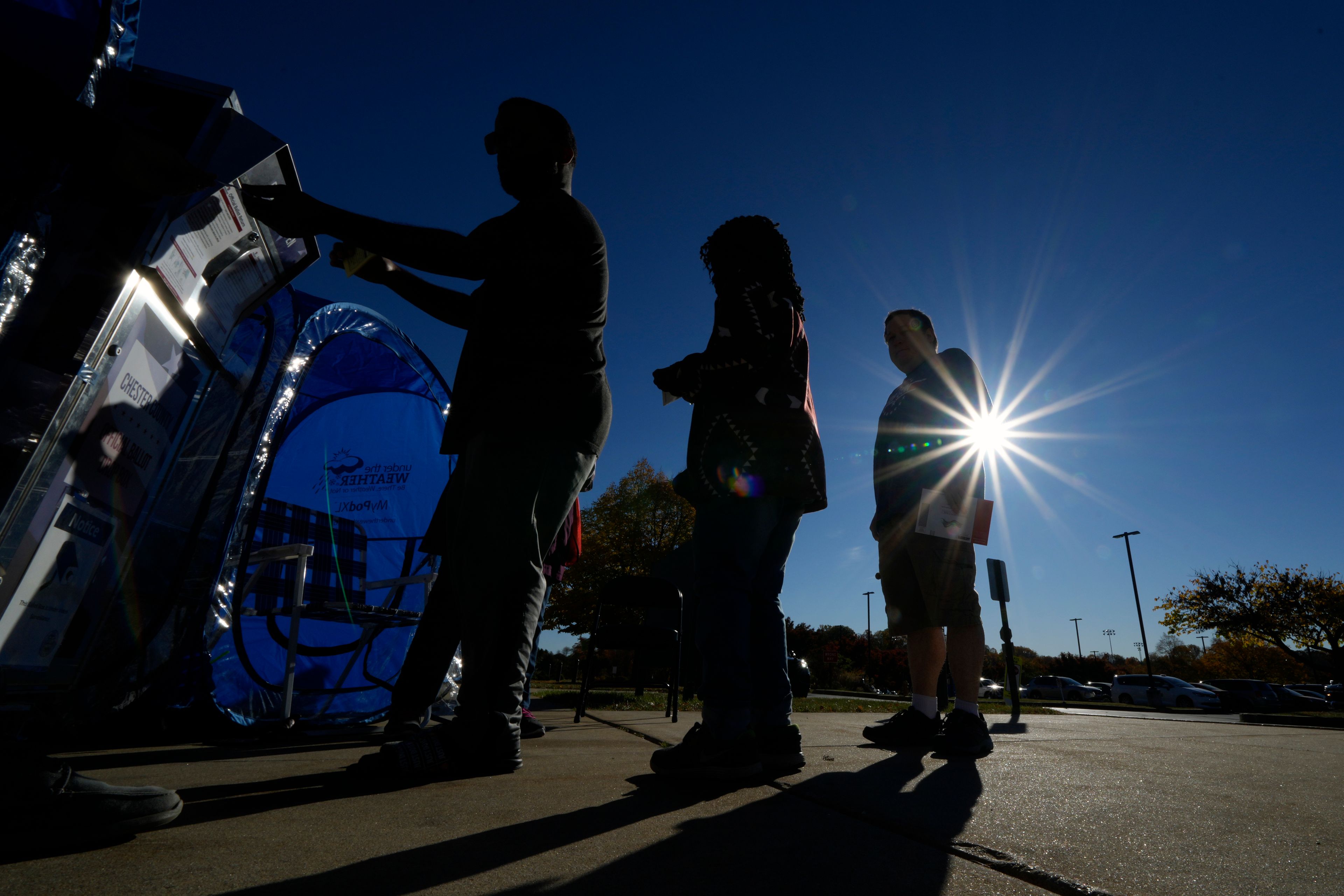 Voters return their mail-in ballots for the 2024 General Election in the United States outside the Chester County Government Services Center, Friday, Oct. 25, 2024, in West Chester, Pa. (AP Photo/Matt Slocum)