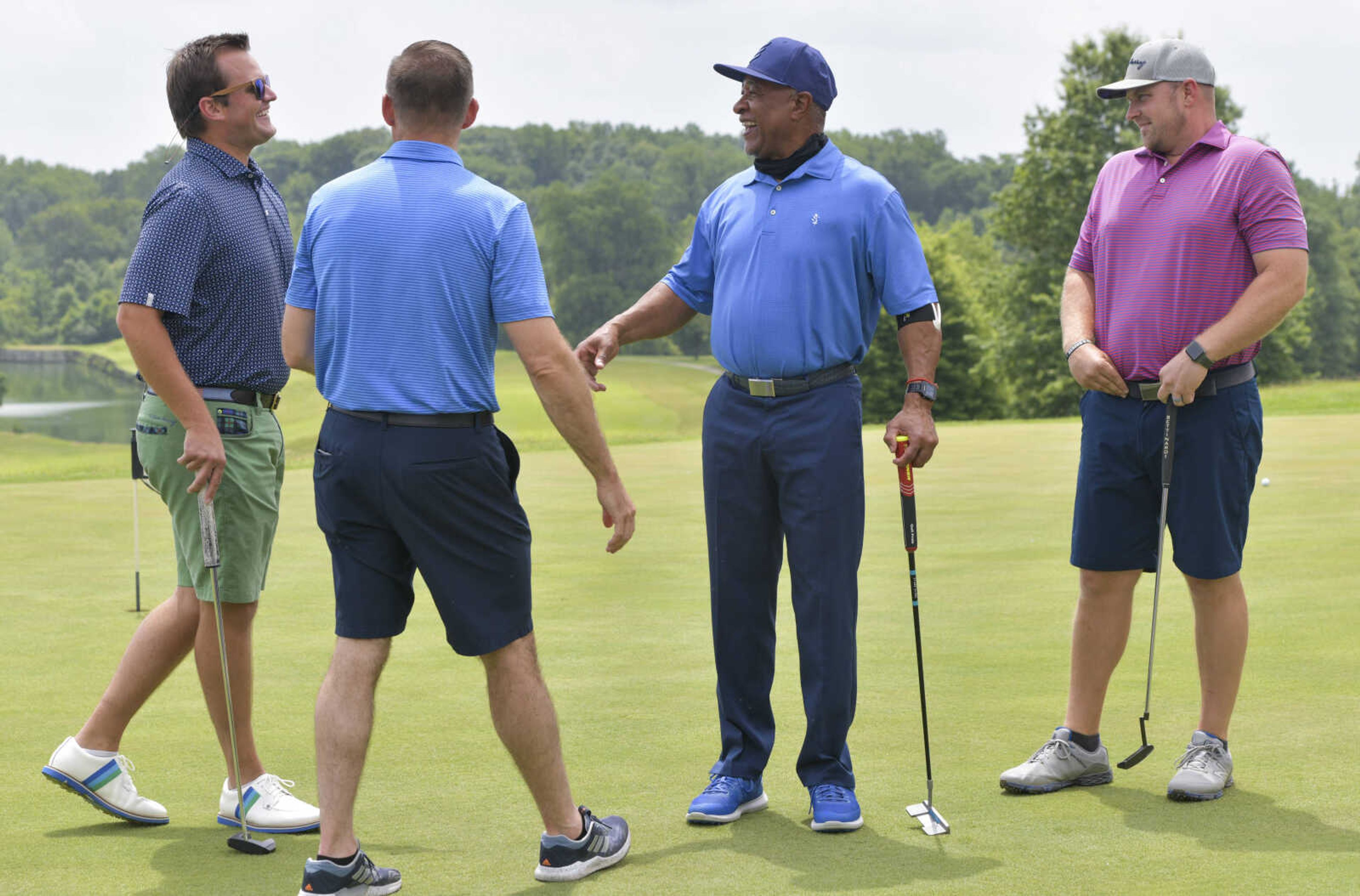 From left; Andrew Moore, Brandon Hahs, Ozzie Smith and Brandon Cooper share a laugh Friday, June 26, 2020, before a round of golf at the Cape Girardeau Country Club.