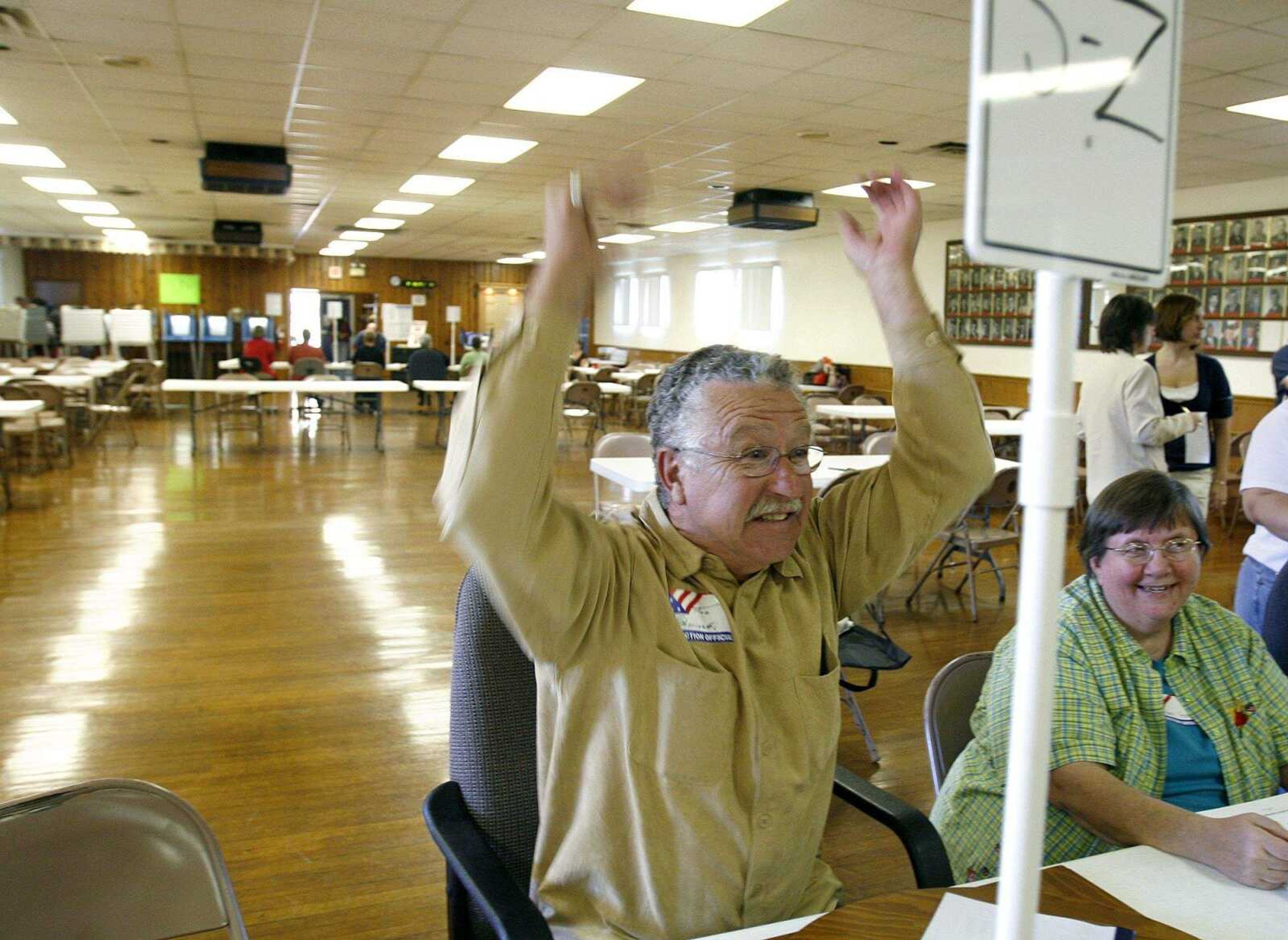 ELIZABETH DODD ~ edodd@semissourian.com
Joe Sherinski, of Jackson, welcomes votors to his line at the American Legion in Jackson on Tuesday. This is the first time Sherinski has volunteered at a precinct.