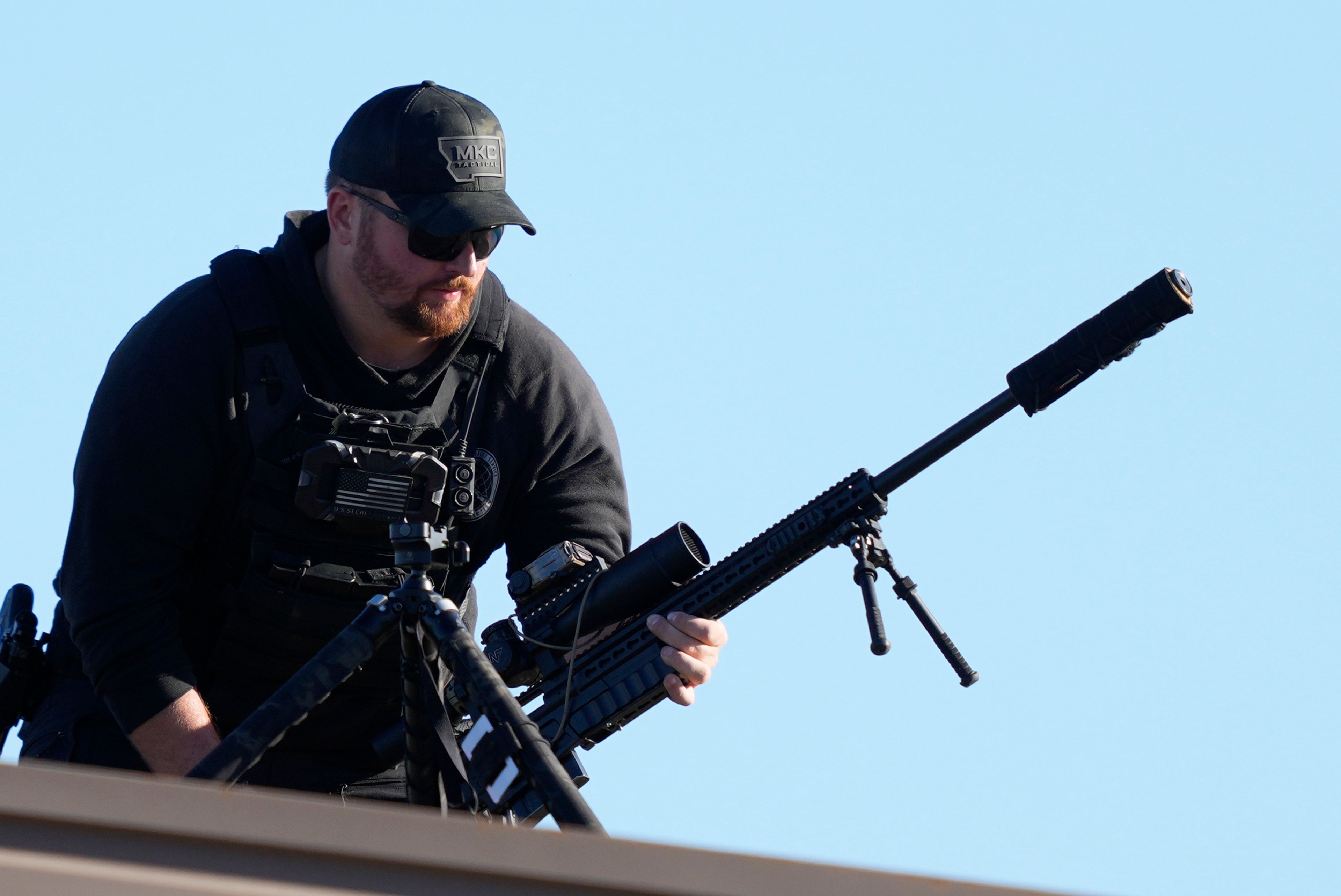 A member of the U.S. Secret Service counter sniper team sets up before Republican presidential nominee former President Donald Trump speaks at a campaign rally, Saturday, Oct. 19, 2024, at Arnold Palmer Regional Airport in Latrobe, Pa. (AP Photo/Matt Rourke)