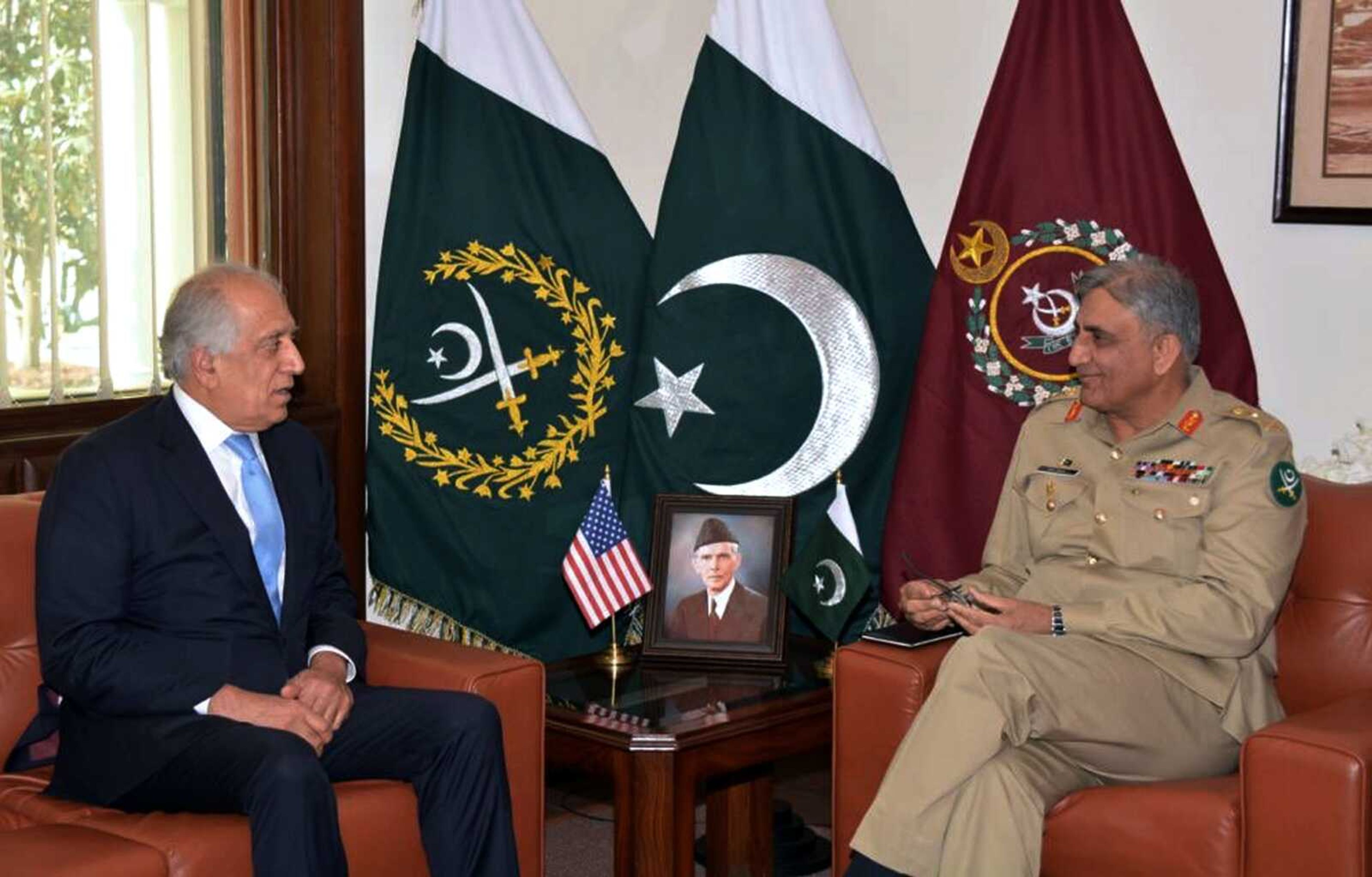 U.S. peace envoy Zalmay Khalilzad, left, talks with Pakistani Army Chief Gen. Qamar Javed Bajwa during a meeting Wednesday in Rawalpindi, Pakistan. Khalilzad's meeting with Pakistan's powerful army chief Bajwa was presumably to brief him on the talks with the Taliban, which Pakistan helped orchestrate by getting the Taliban to the UAE.