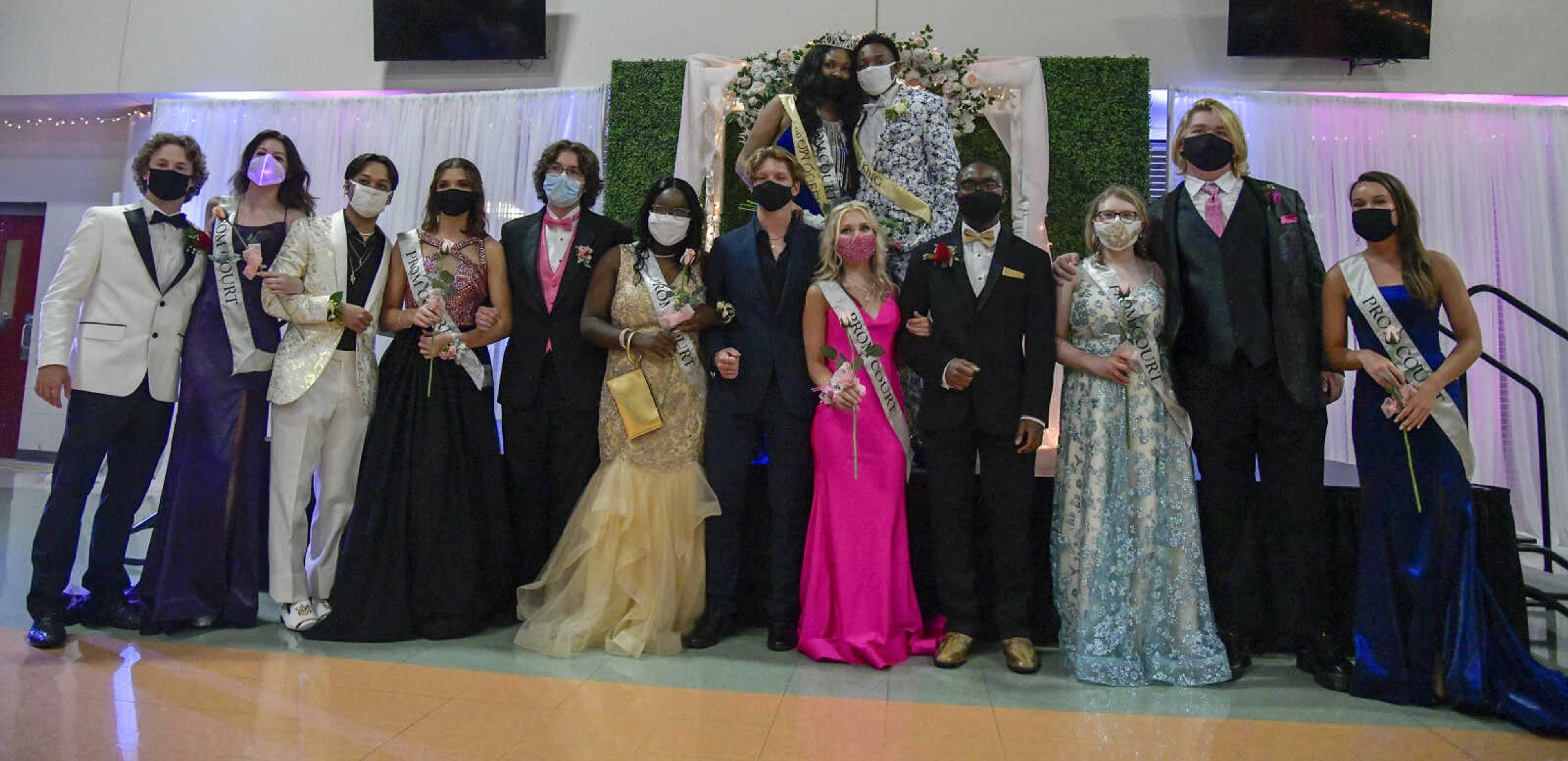 The prom king and queen Issah Williams and Bryonna Thomas pose for a photo with the prom court during the prom at Cape Central High School in Cape Girardeau on Saturday, May 8, 2021.