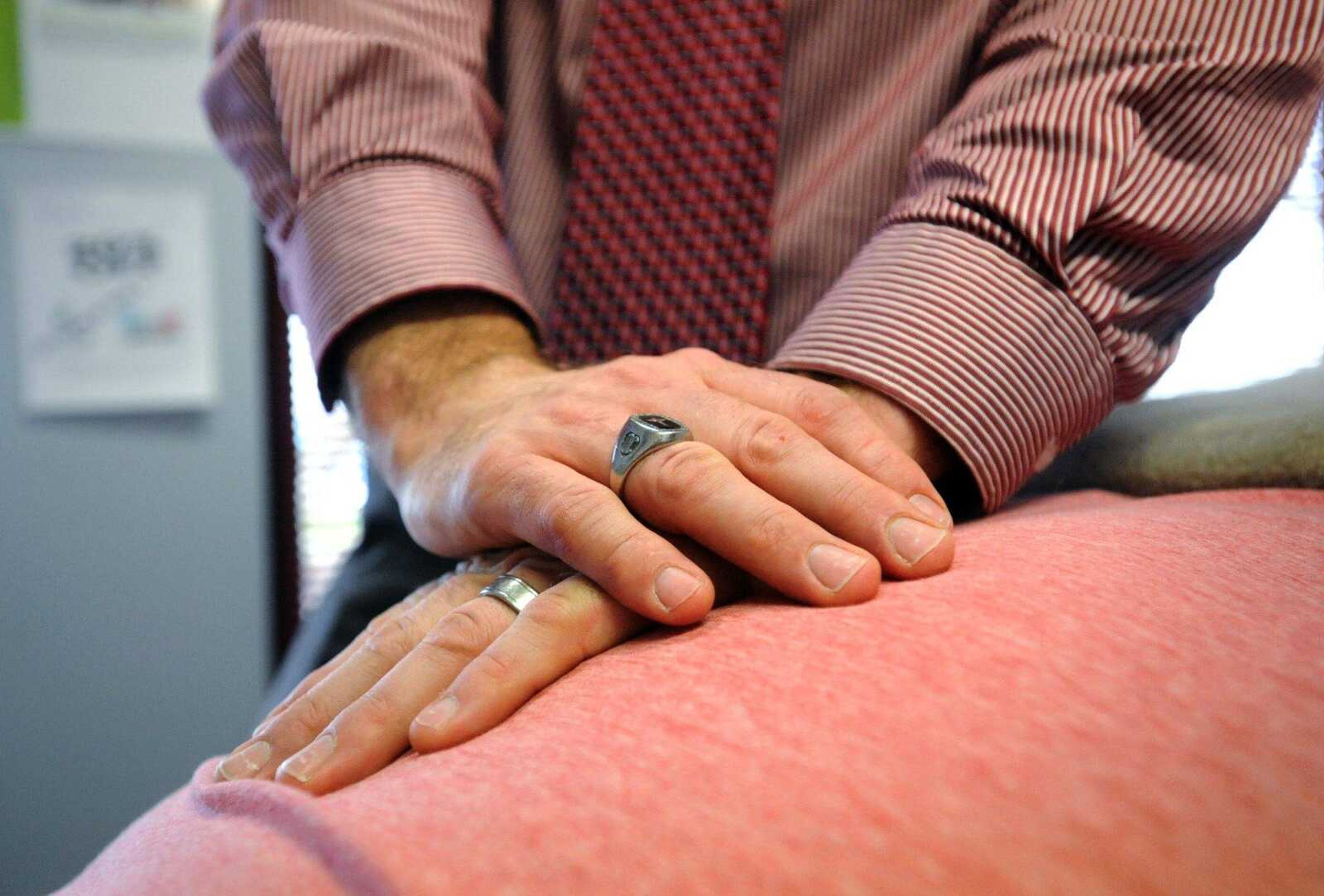 Dr. Gregory W. Pursley works on a patient inside PC Wellness Centers in Cape Girardeau. (Laura Simon)