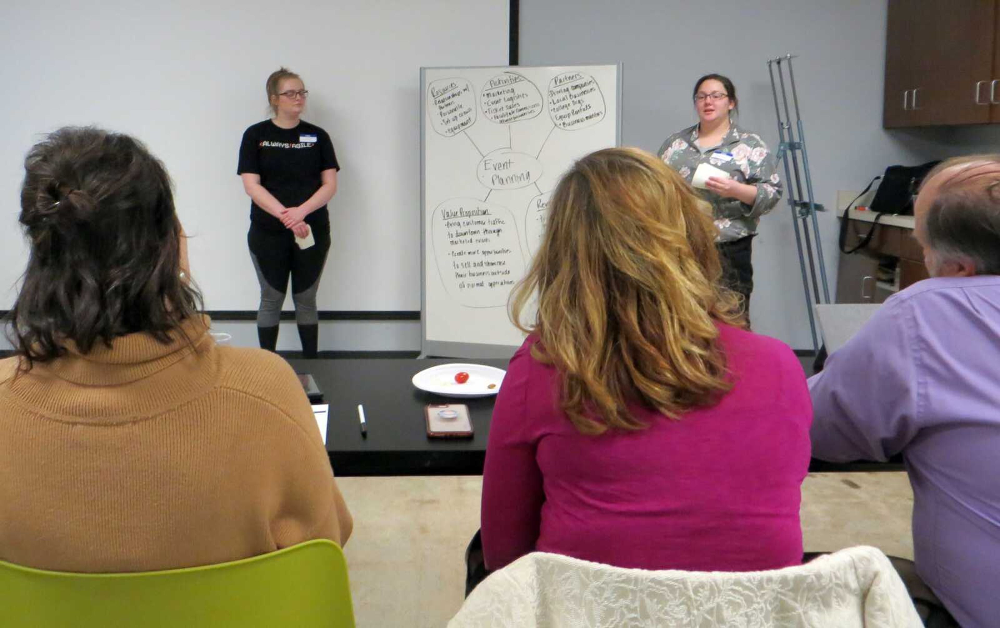 Savanna Weston and Jaedyn Weimer present their solution to a panel of judges during Southeast Missouri State University's first Blue Hack on Saturday at Catapult Creative House in downtown Cape Girardeau.