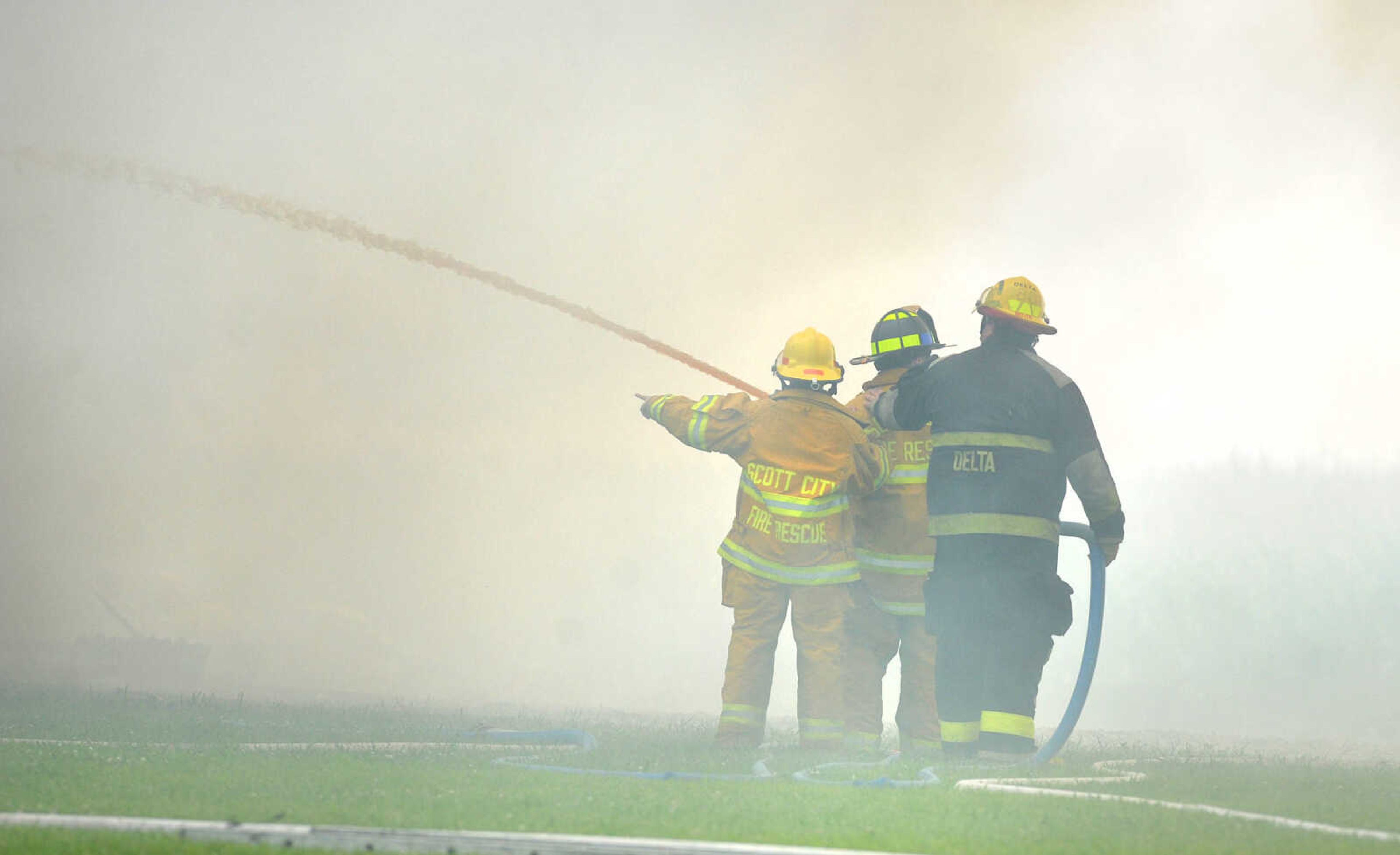 LAURA SIMON ~ lsimon@semissourian.com

Firefighters from Delta, Scott City, Chaffee and New Hamburg/Benton/Commerce battle a house fire off County Road 204 in Scott County Wednesday afternoon, July 23, 2014.