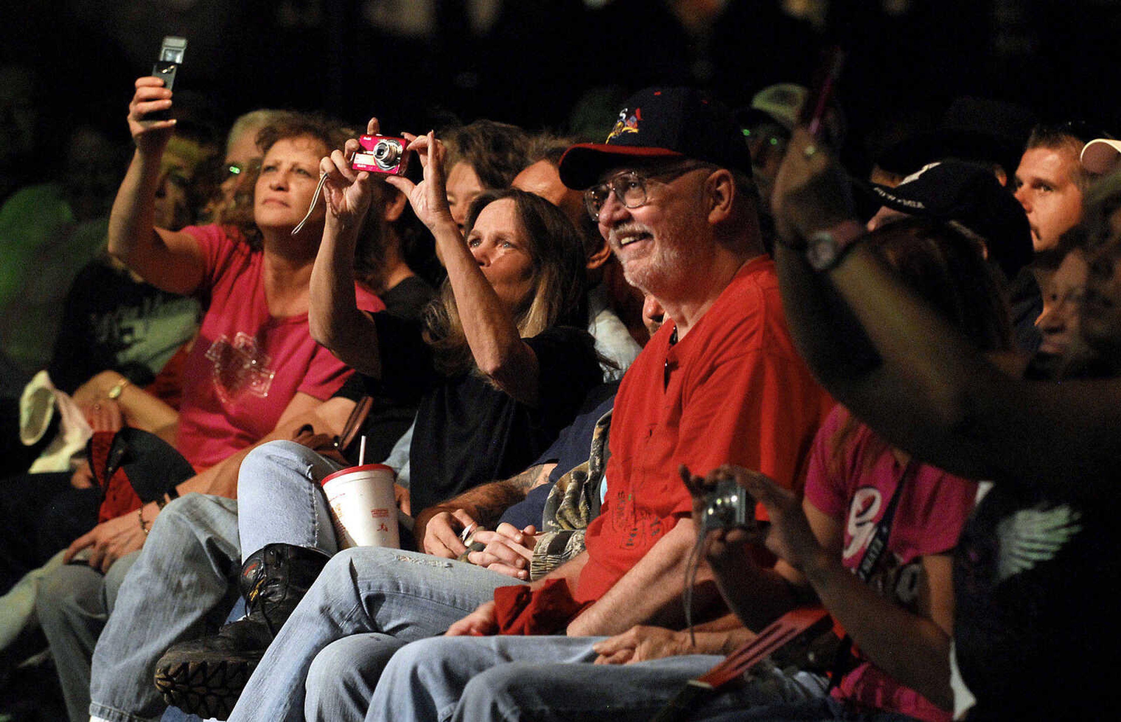 LAURA SIMON~lsimon@semissourian.com
Fans take out their cameras to capture Mel Tillis as he performs in the grandstand at Arena Park Thursday, September 16, 2010 during the 155th Annual SEMO District Fair.