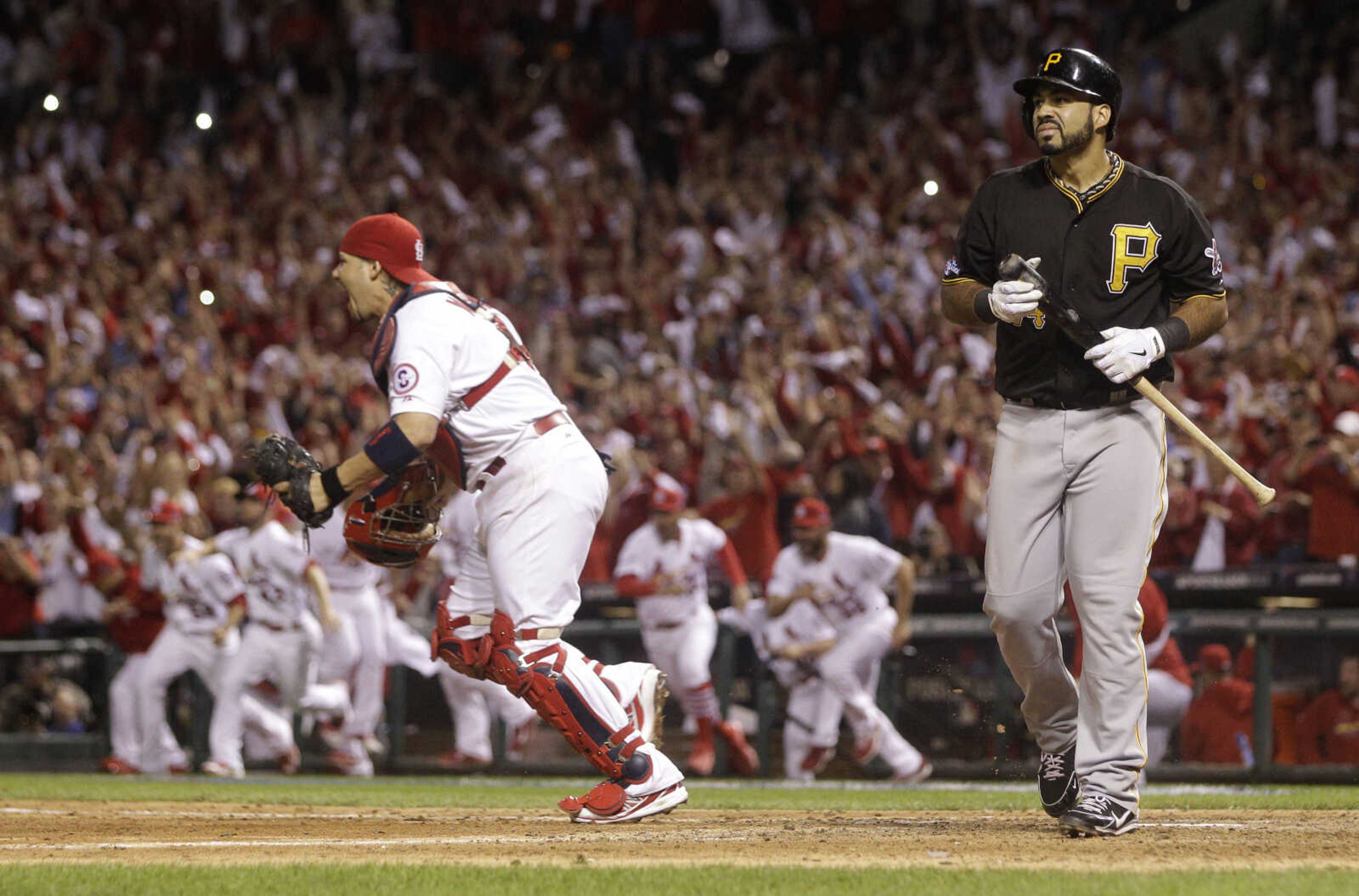 Pittsburgh Pirates' Pedro Alvarez walks off the field after striking out for the final out of Game 5 of a National League baseball division series against the St. Louis Cardinals, Wednesday, Oct. 9, 2013, in St. Louis. The Cardinals won 6-1, and advanced to the NL championship series against the Los Angeles Dodgers. (AP Photo/Charlie Riedel)