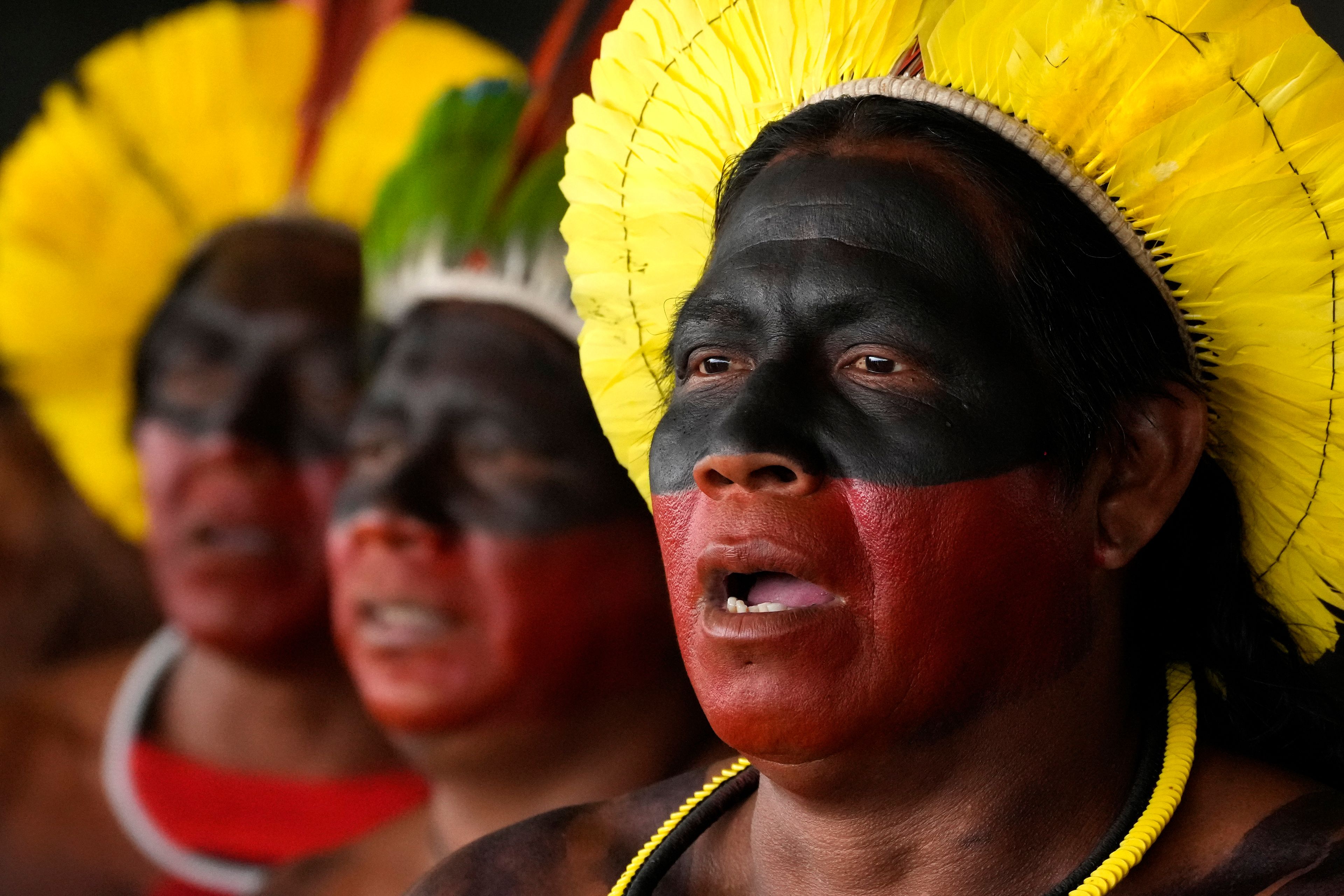 Kayapos sing during a protest against a proposed constitutional amendment that threatens some Indigenous land rights, in Brasilia, Brazil, Wednesday, Oct. 30, 2024. (AP Photo/Eraldo Peres)