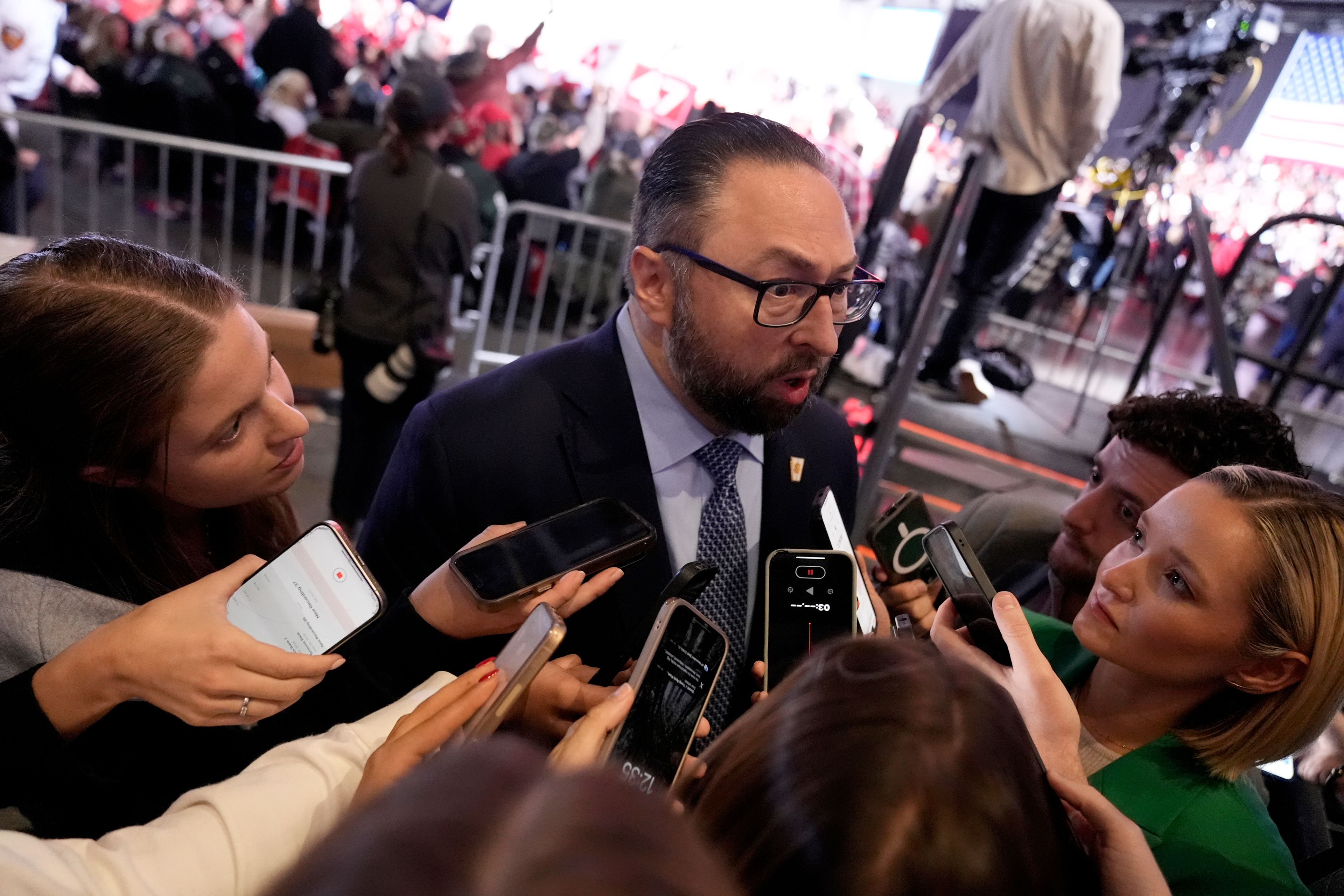 Jason Miller speaks with reporters at a campaign rally for Republican presidential nominee former President Donald Trump at the Suburban Collection Showplace, Saturday, Oct. 26, 2024 in Novi, Mich. (AP Photo/Alex Brandon)