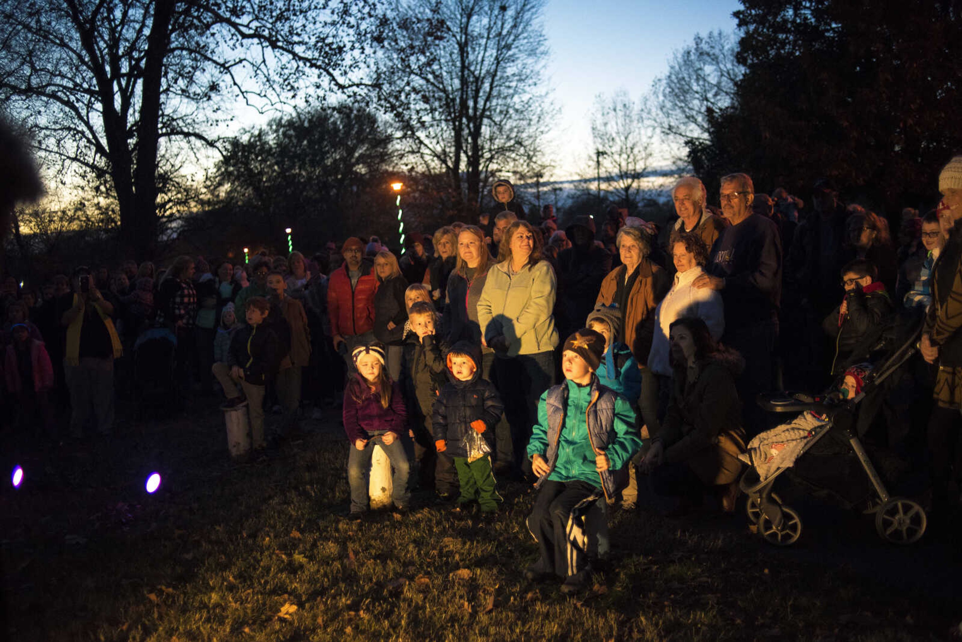 People wait for the lights to be turned on during the Jackson Holiday Extravaganza Friday, Nov. 24, 2017 at the Jackson City Park.