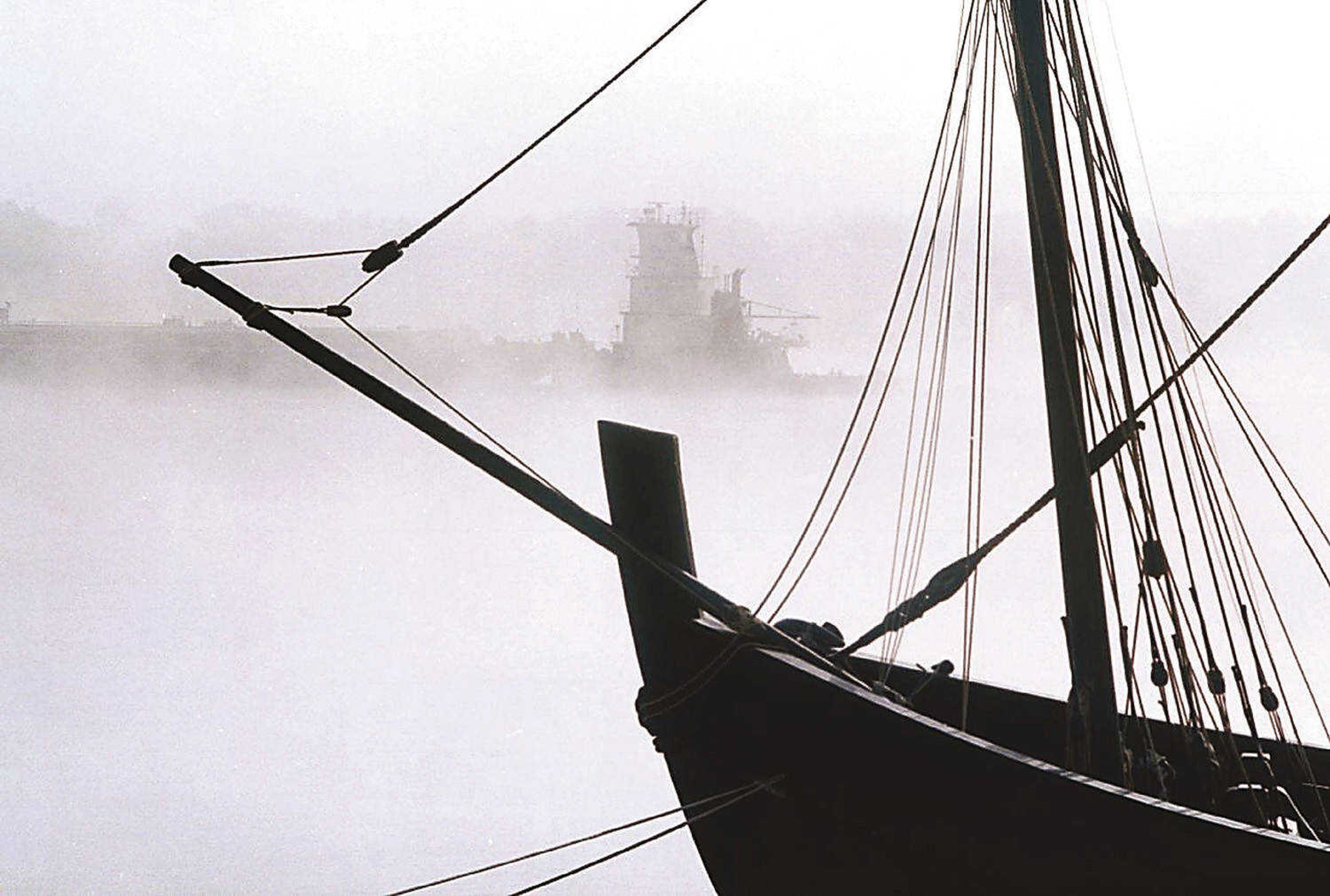 Southeast Missourian/Fred Lynch
The towboat Creole Pride moved up the fog-shrouded Mississippi River at Cape Girardeau past the replica of the Nina, one of Columbus' three ships, on Oct. 5, 1999. The sailing museum was docked at Riverfront Park.