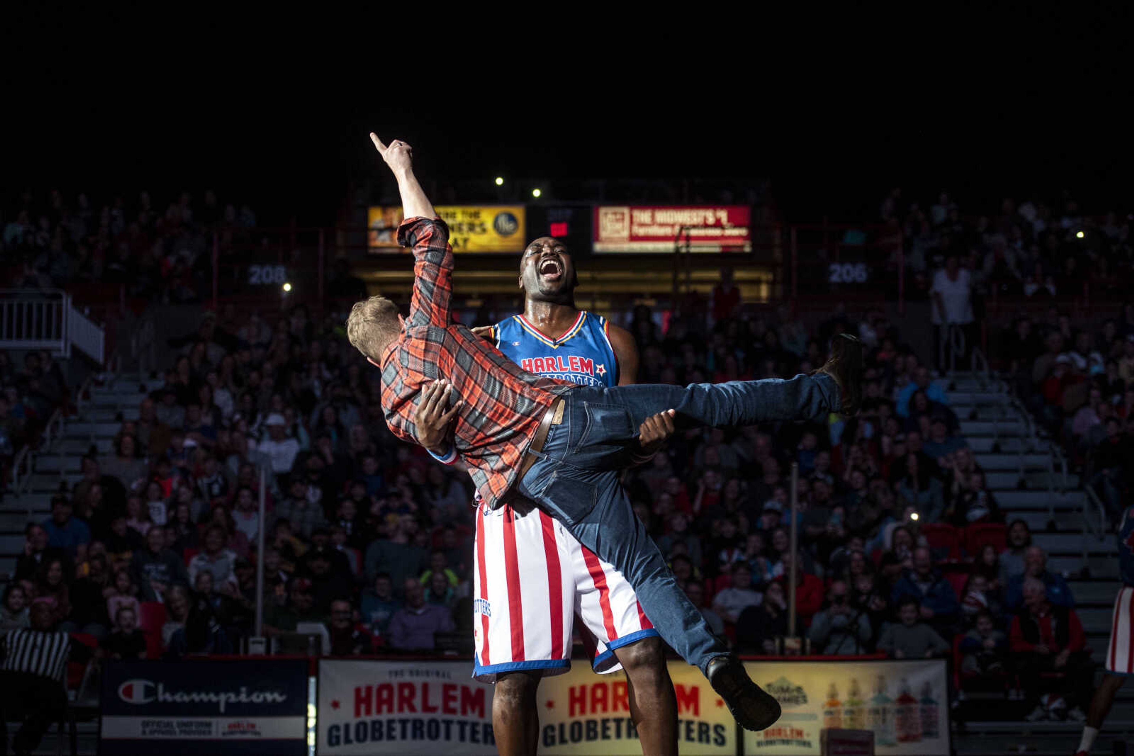 "Big Easy" Lofton (52) holds John Kinder as he spins him around during the Harlem Globetrotters matchup against the Washington Generals at the Show Me Center Wednesday, Jan. 16, 2019, in Cape Girardeau.