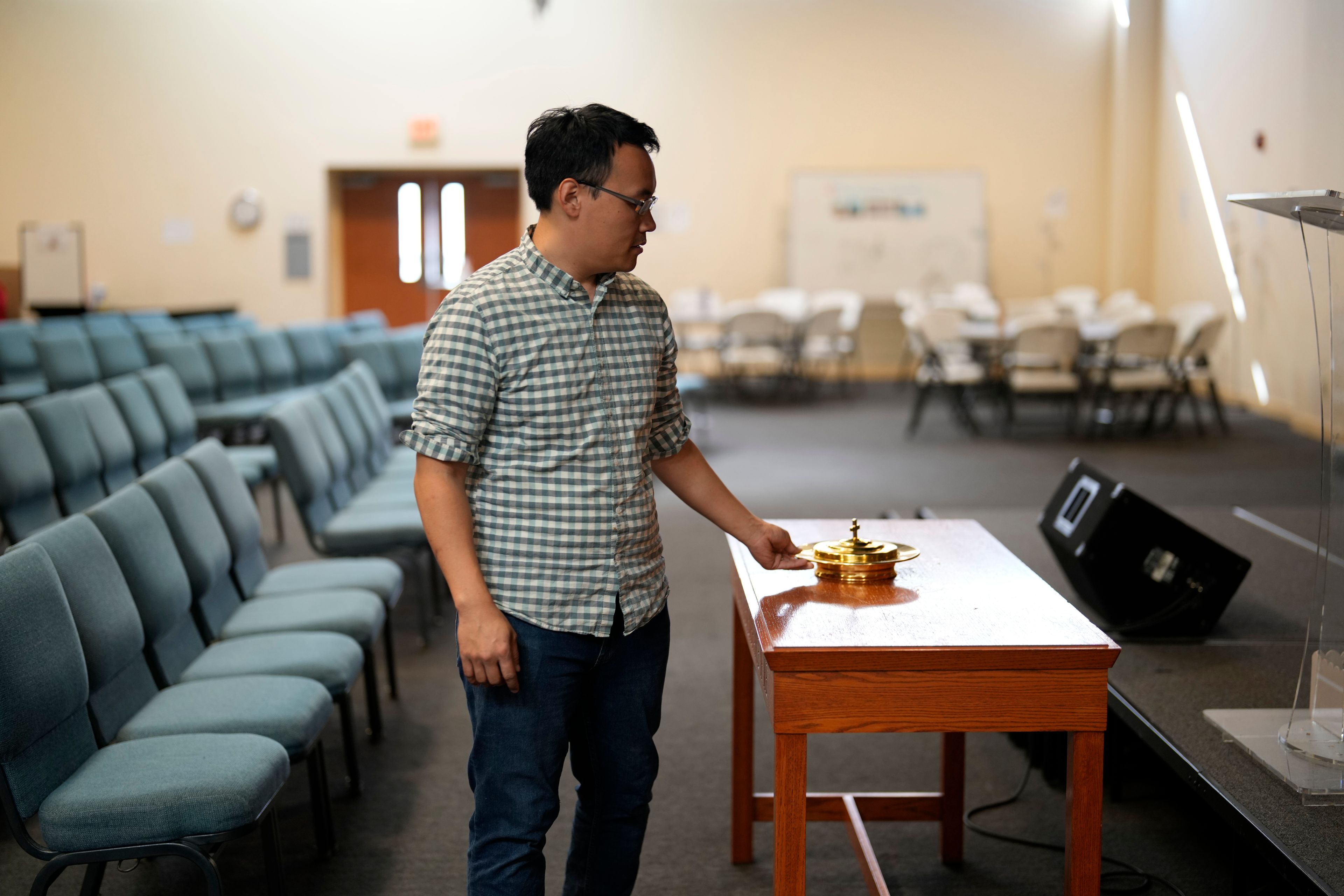 Pastor Wayne Lee walks through the Chinese Christian Church and Center, Thursday, Oct. 10, 2024, in Philadelphia. (AP Photo/Matt Slocum)