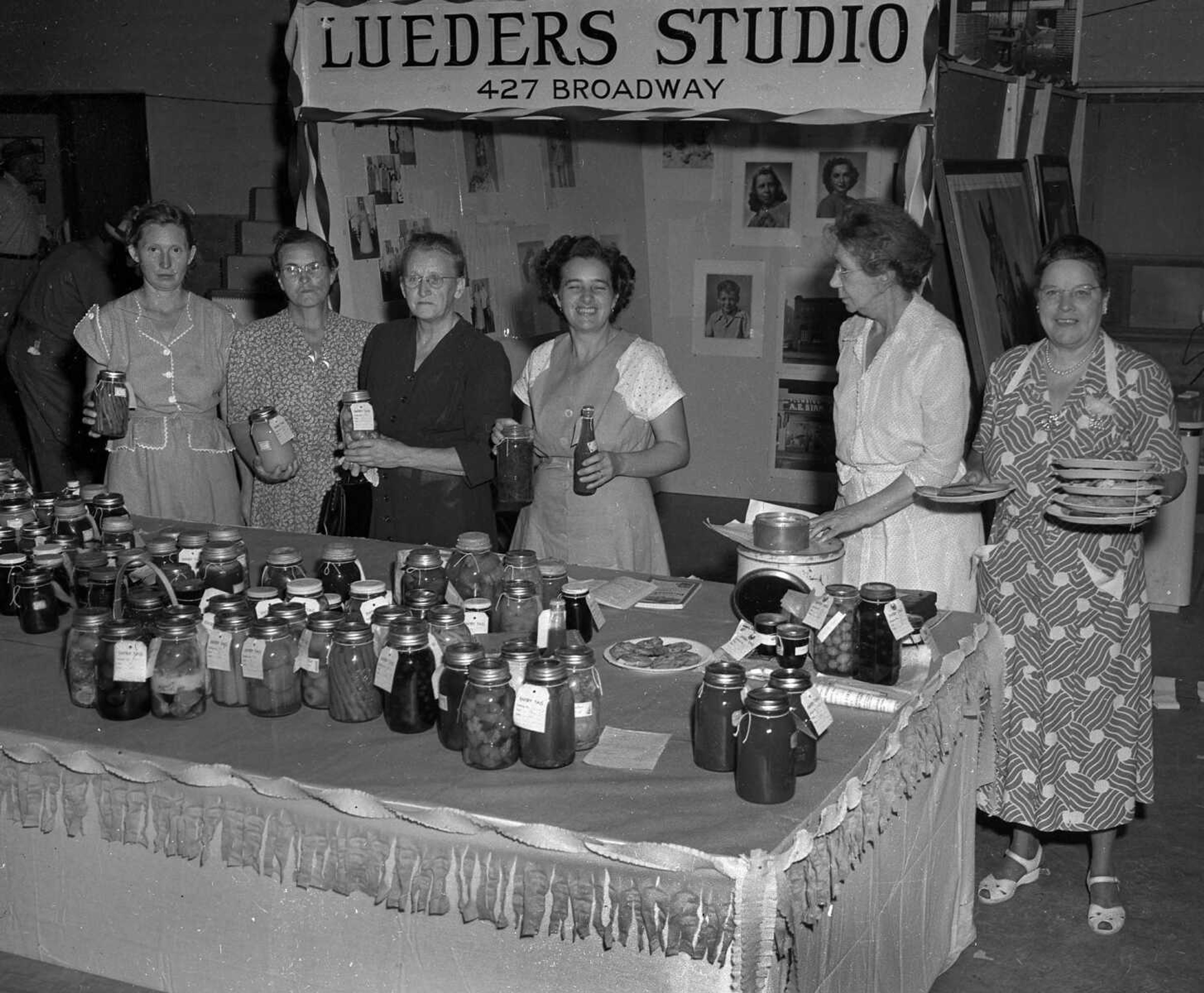 Entries to the annual canning and baking contests held at the SEMO District Fair line a table, and ladies are lined up to add their own handiworks. If you can provide information about the image, send a note to librarian Sharon Sanders at ssanders@semissourian.com.