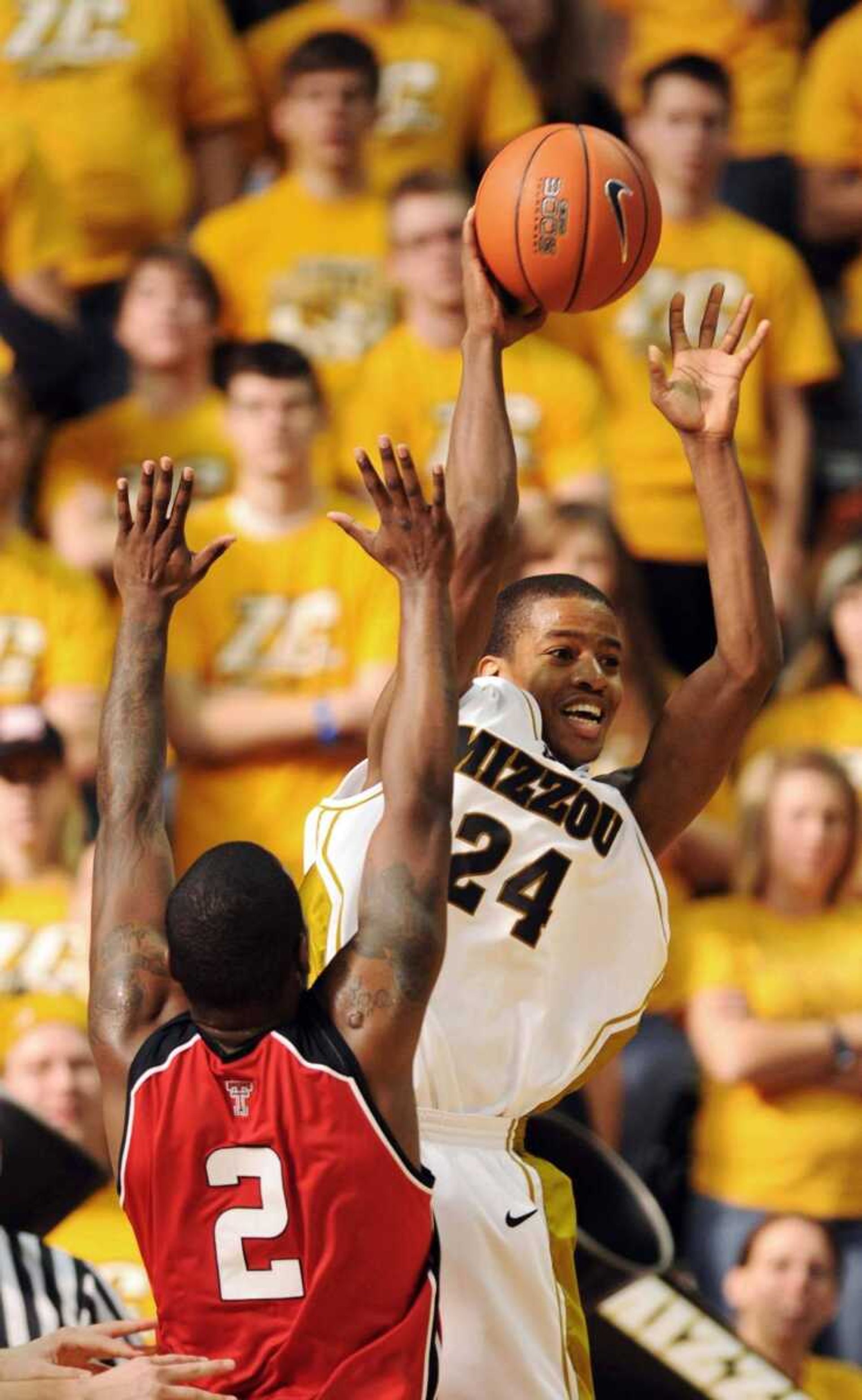 L.G. PATTERSON ~ Associated PressMissouri's Kim English throws a pass around Texas Tech's Rogdrick Craig during the first half Saturday in Columbia, Mo.