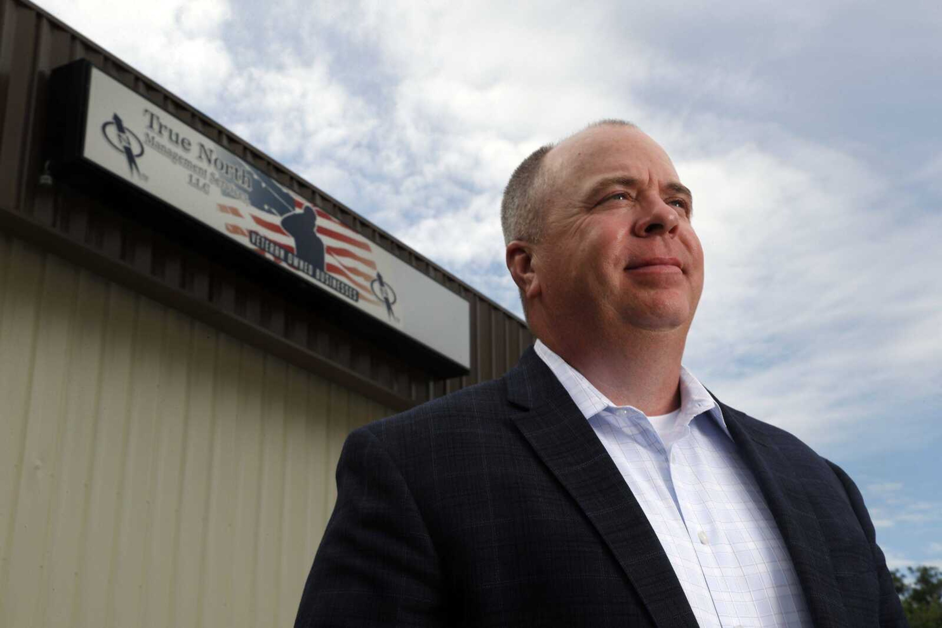 In this Tuesday, May 23, 2017, photo, Steve Myers, owner of True North Management Services, poses for a photo at the company in Fenton, Mo. Myers is a United States Coast Guard veteran who now heads the company that builds and manages cellphone networks and has a program to train and hire veterans. (AP Photo/Jeff Roberson)